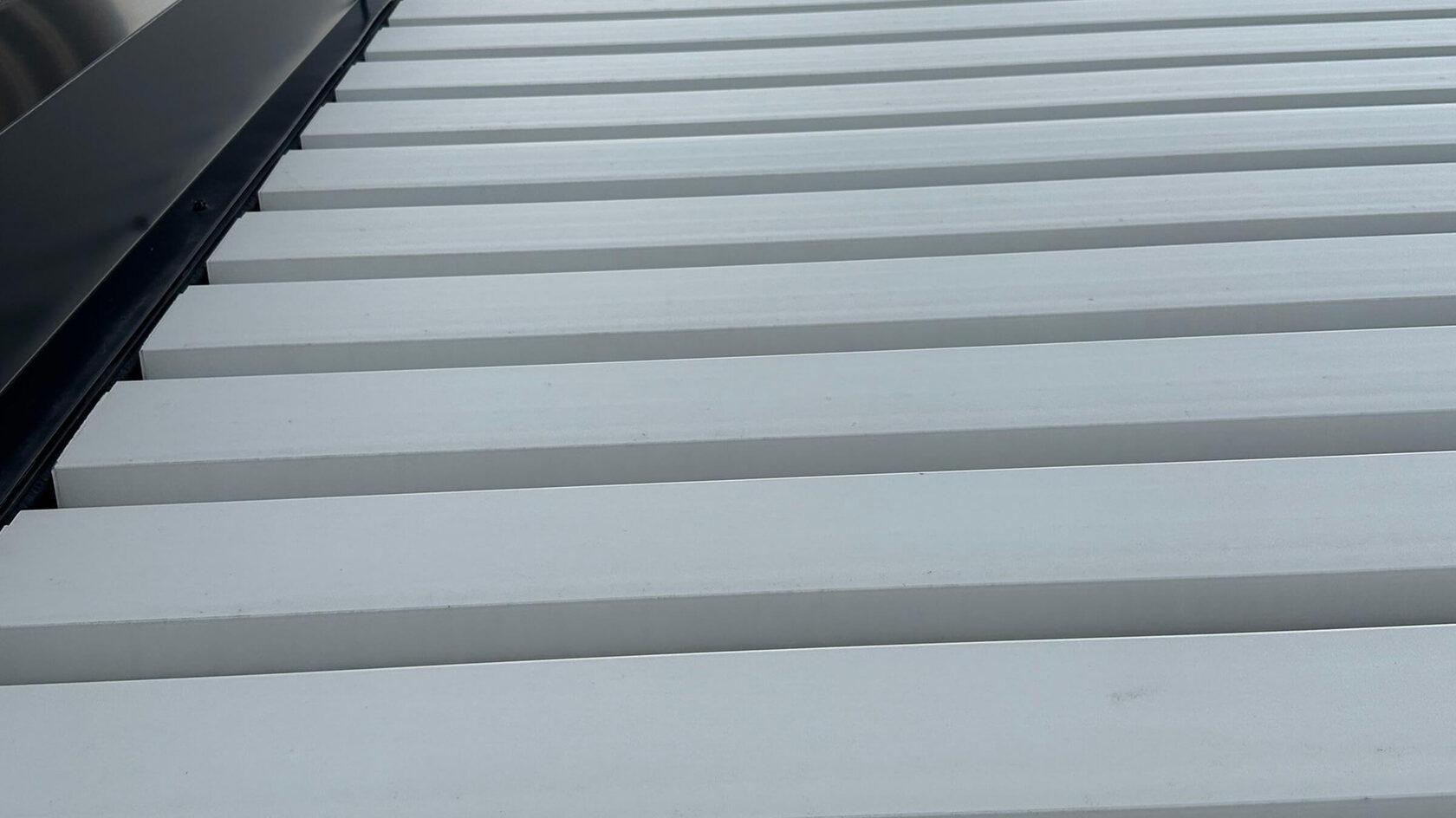 Close-up of aluminum pergola louvers showing build quality
