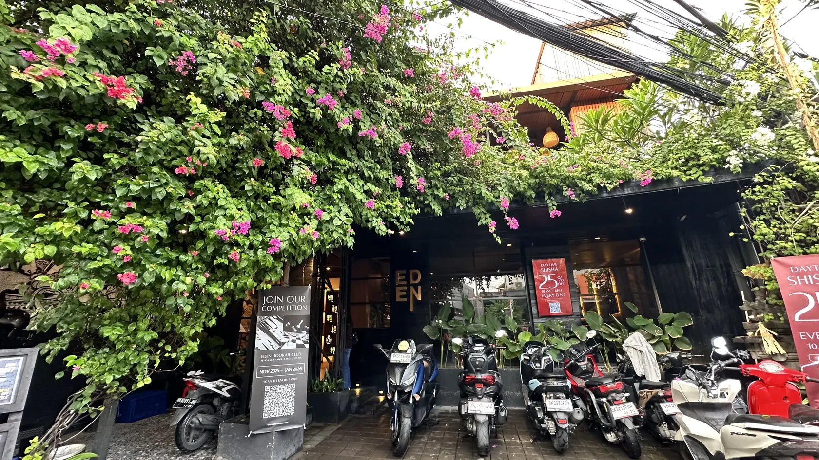 Exterior of Eden Hookah Club Seminyak surrounded by tropical greenery on Jl. Petitenget