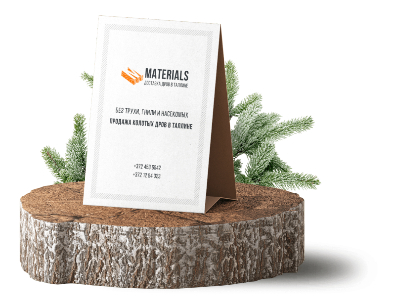 Карточка с контактами стоит на срезе дерева