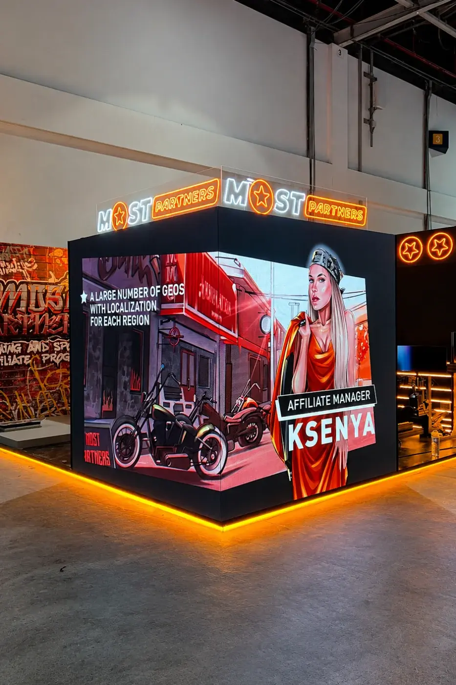 Themed activation space with a motorcycle display and feature lighting
