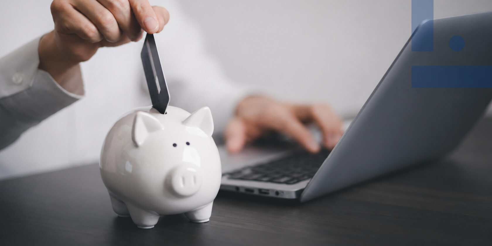 piggy bank next to laptop — Moldova tax reform 2027 VAT on utilities, salaries and real estate
