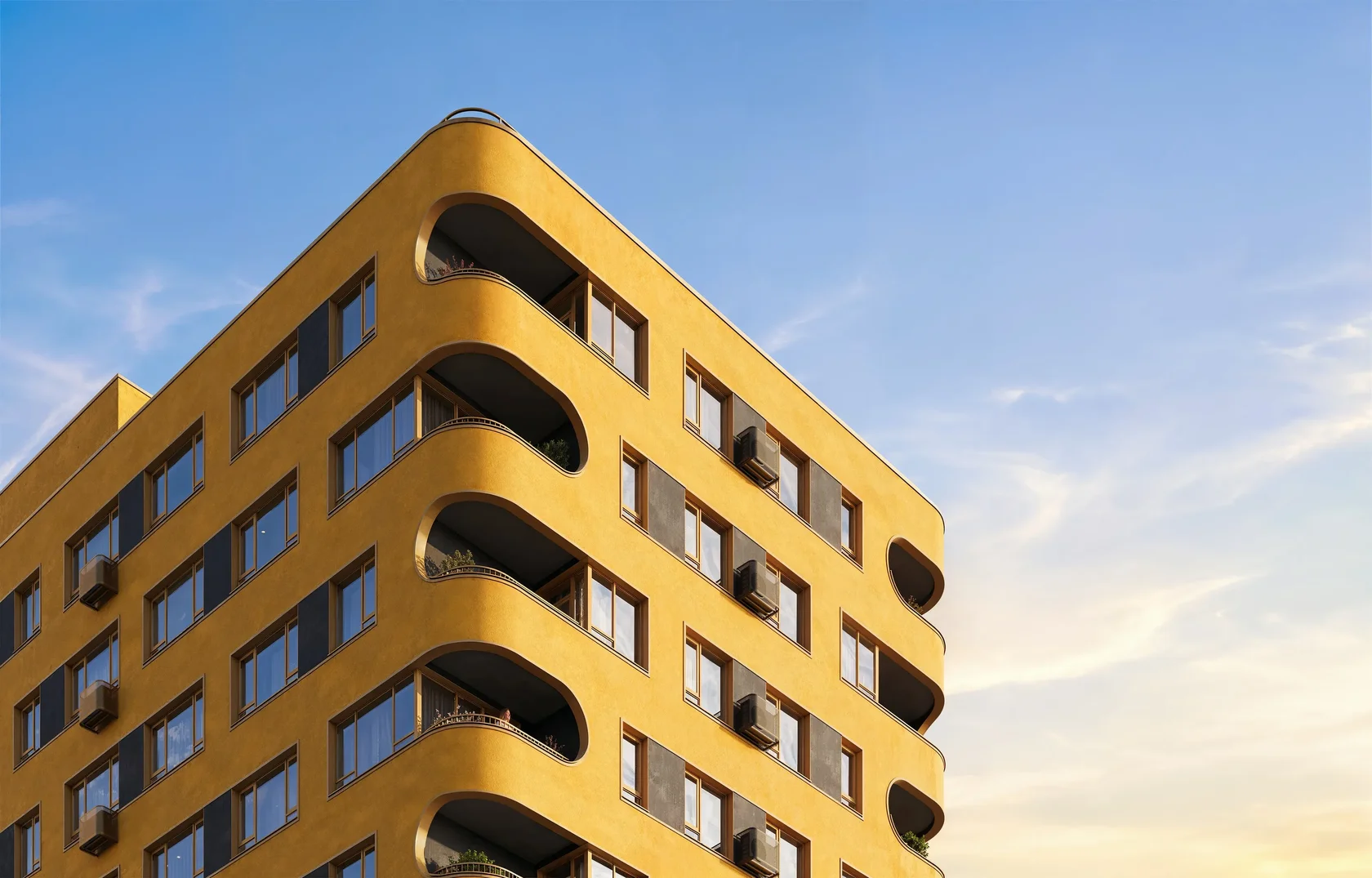 Yellow facade with rounded balconies