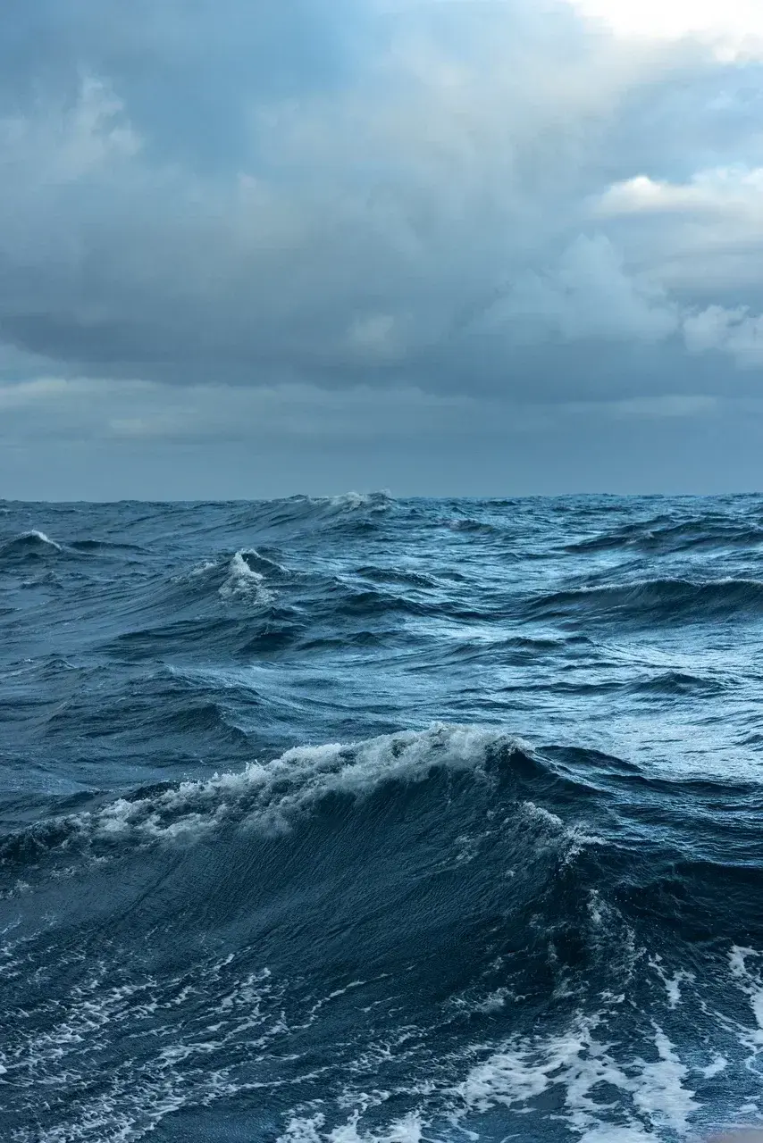 Rough seas and powerful waves in the Drake Passage during an Antarctica sailing expedition under dramatic polar skies