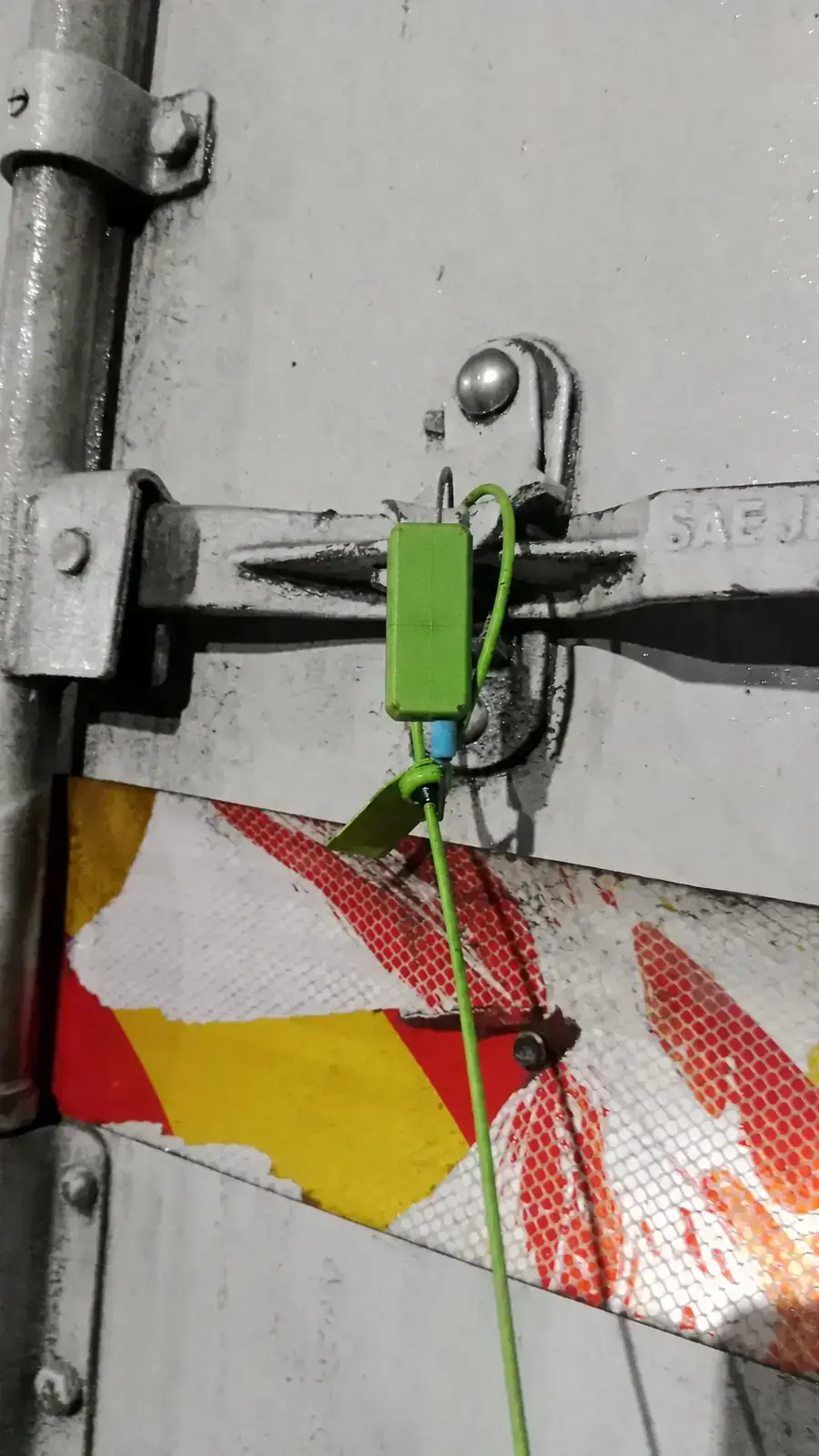 Control seal attached to a transport door with identifier masked