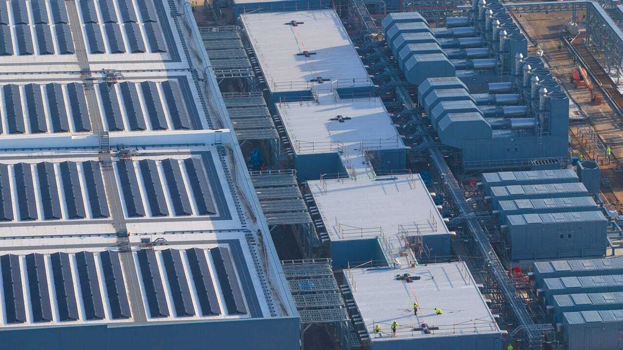 Aerial view of a modern hyperscale data center facility in the Netherlands, showcasing large-scale digital infrastructure and power integration.
