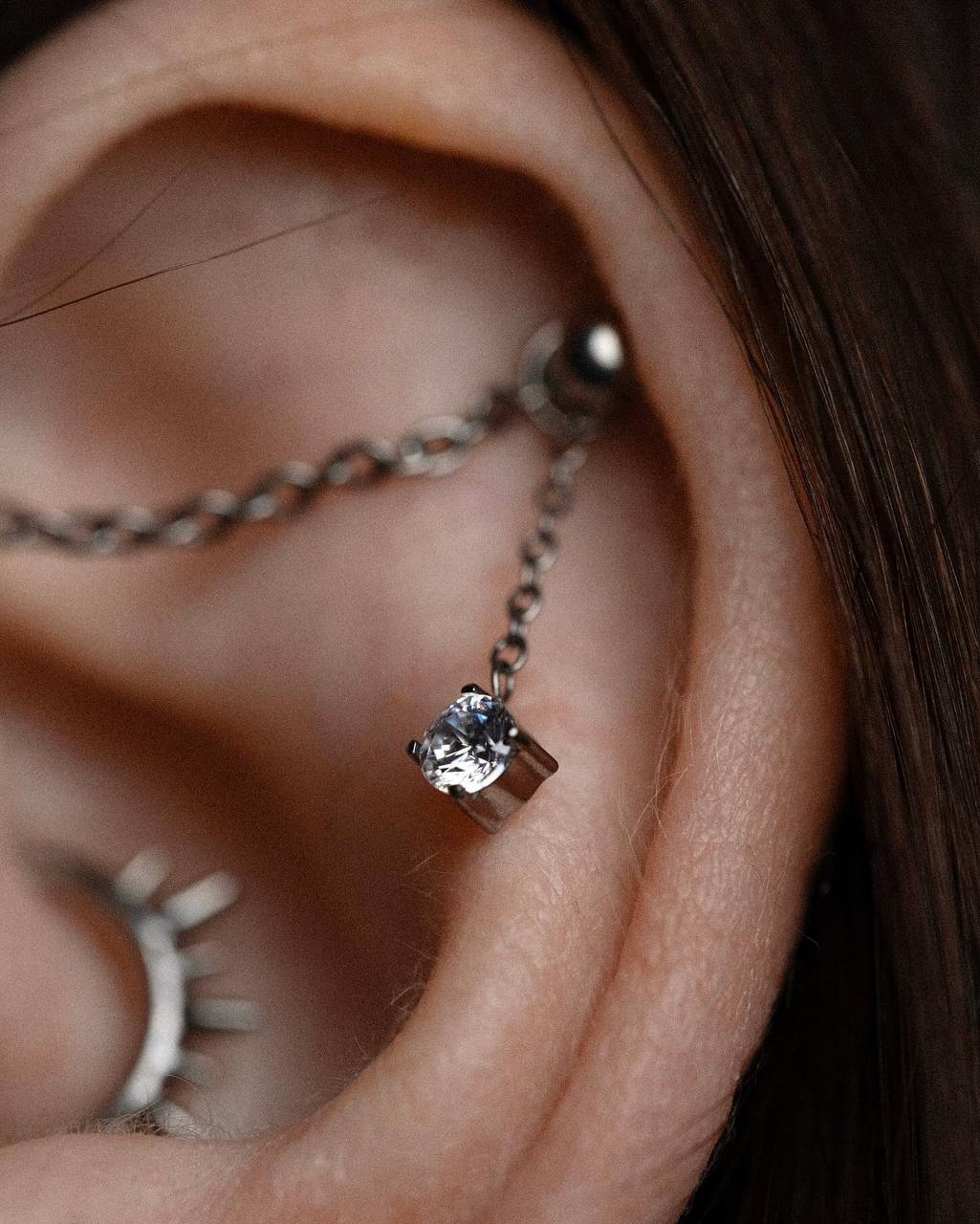 Прокол верхнего хряща уха