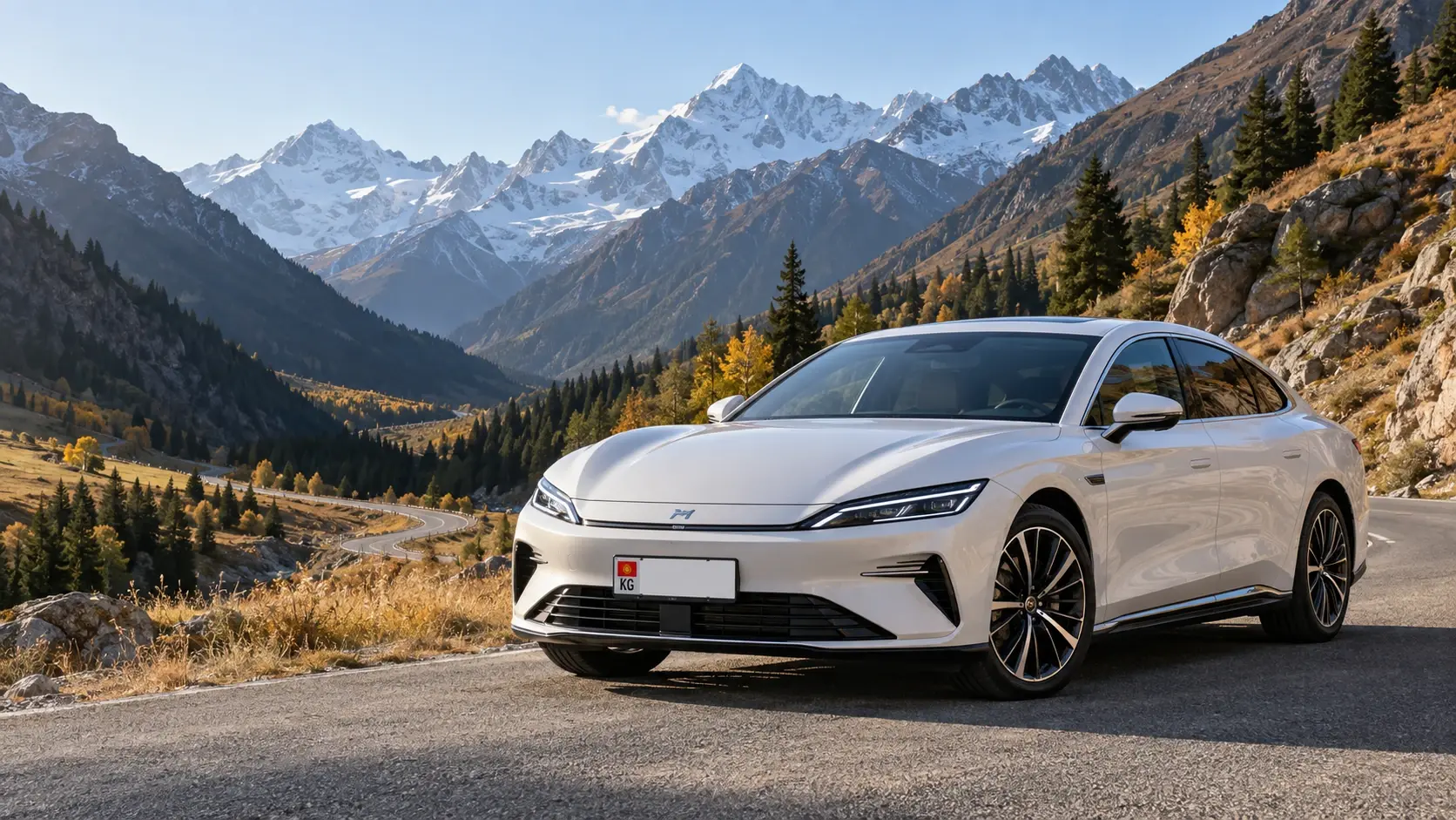 Белый автомобиль с кыргызским номерным знаком на фоне гор