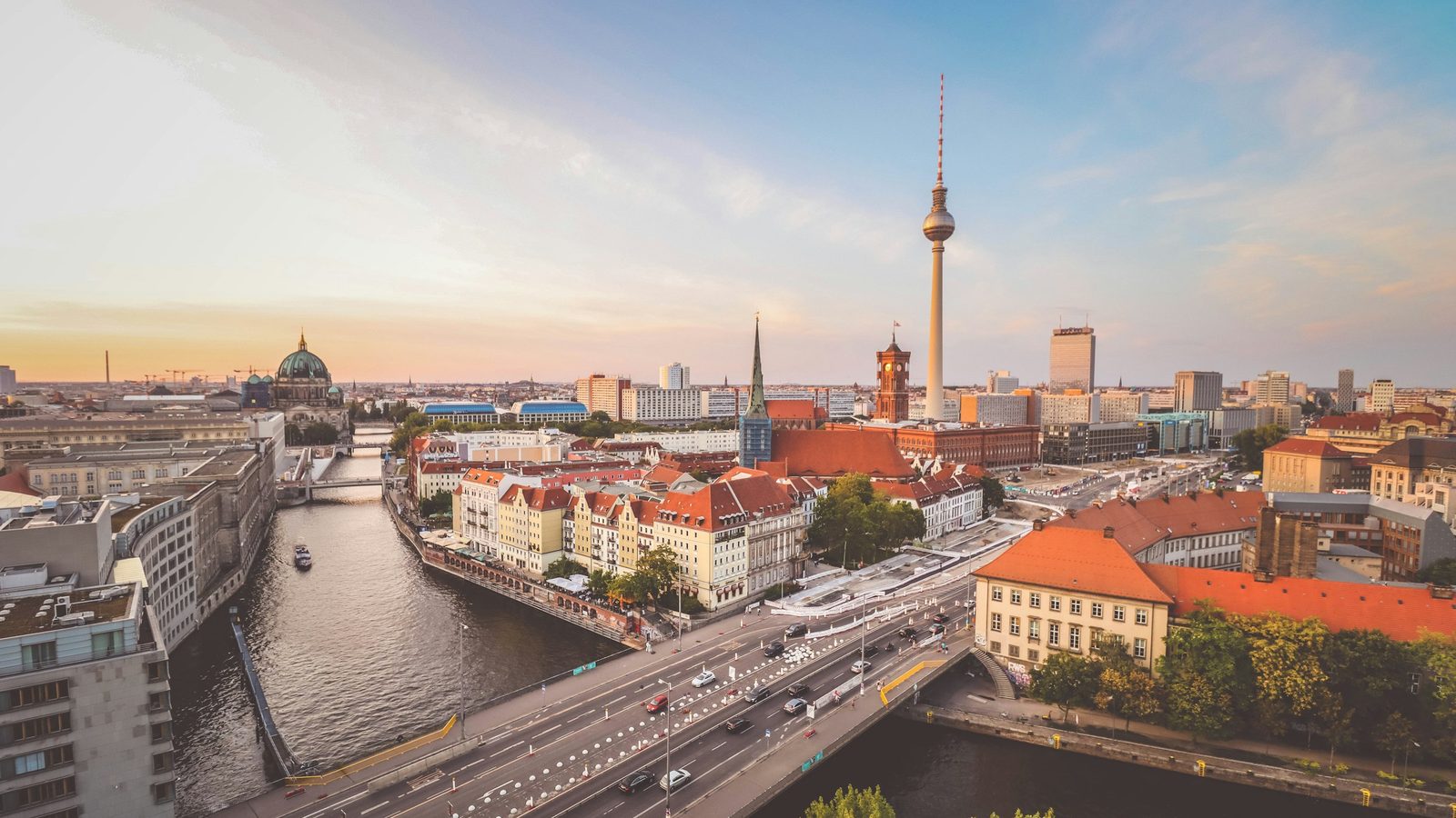 Berlin skyline at sunset with the TV tower, the red town hall and Berlin Cathedral above the River Spree
