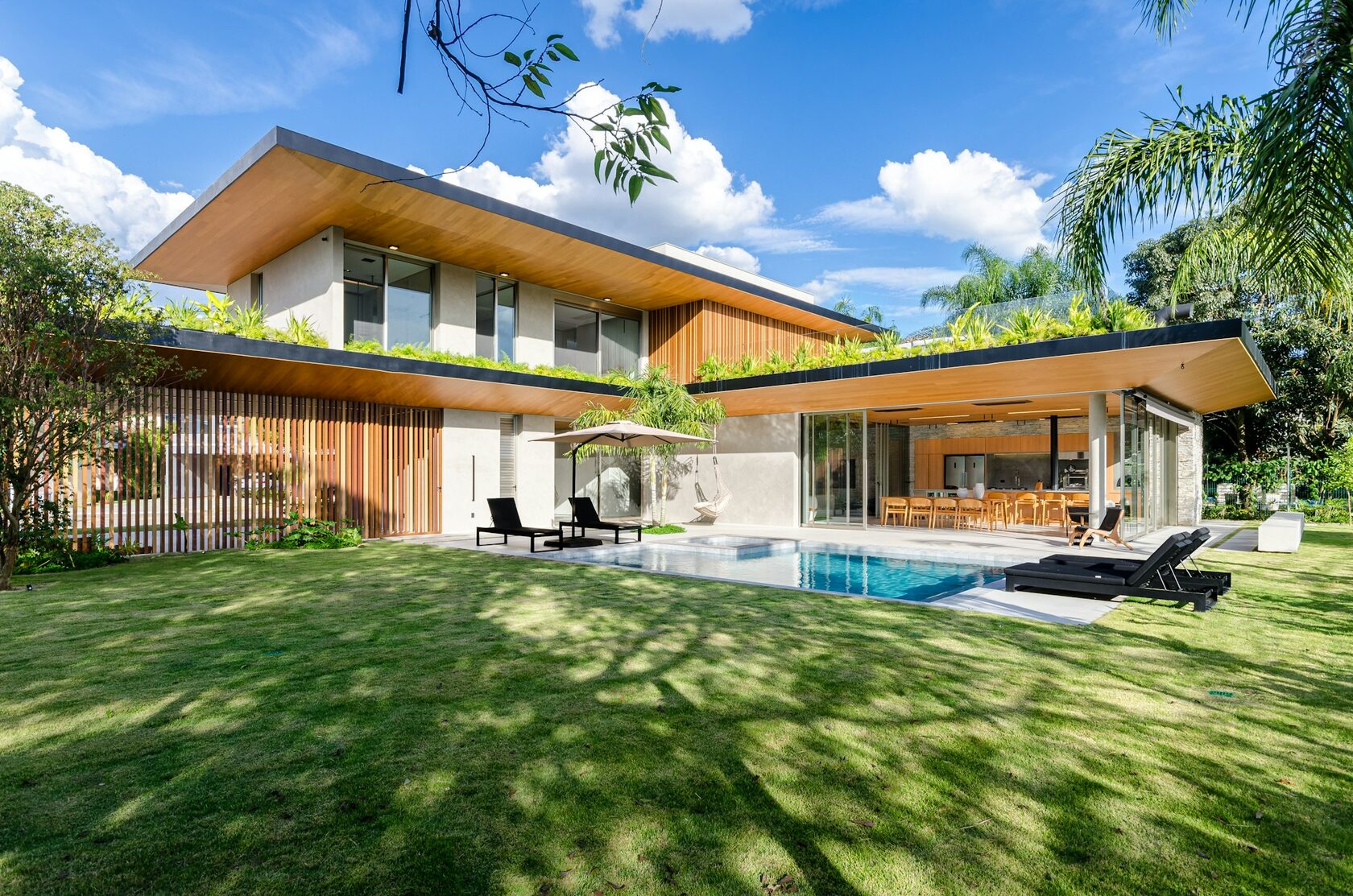 Modern luxury villa exterior with tropical garden