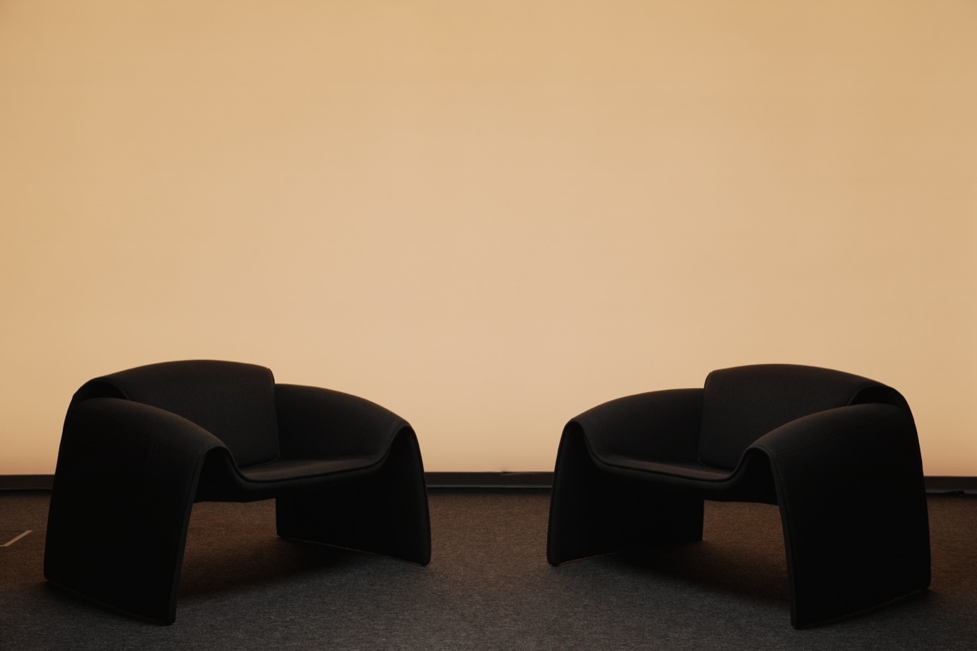 Studio wall lit in a warm cream tone
