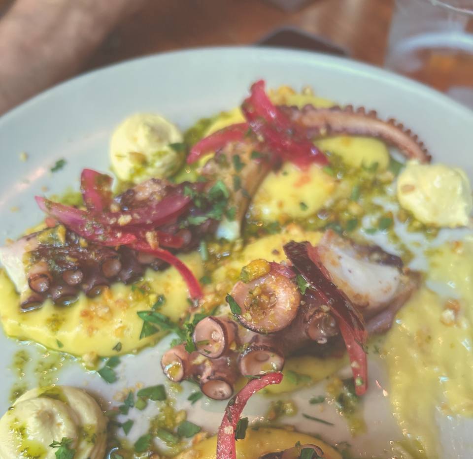 Slow-cooked octopus over potato cream with pickled red onion at Sensi Barcelona