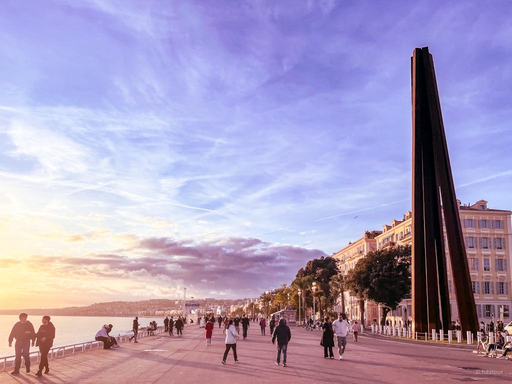 Bernar Venet monumental steel sculpture on the Promenade des Anglais in Nice, created for the 150th anniversary of Nice’s annexation to France, sunset view with Mediterranean seafront