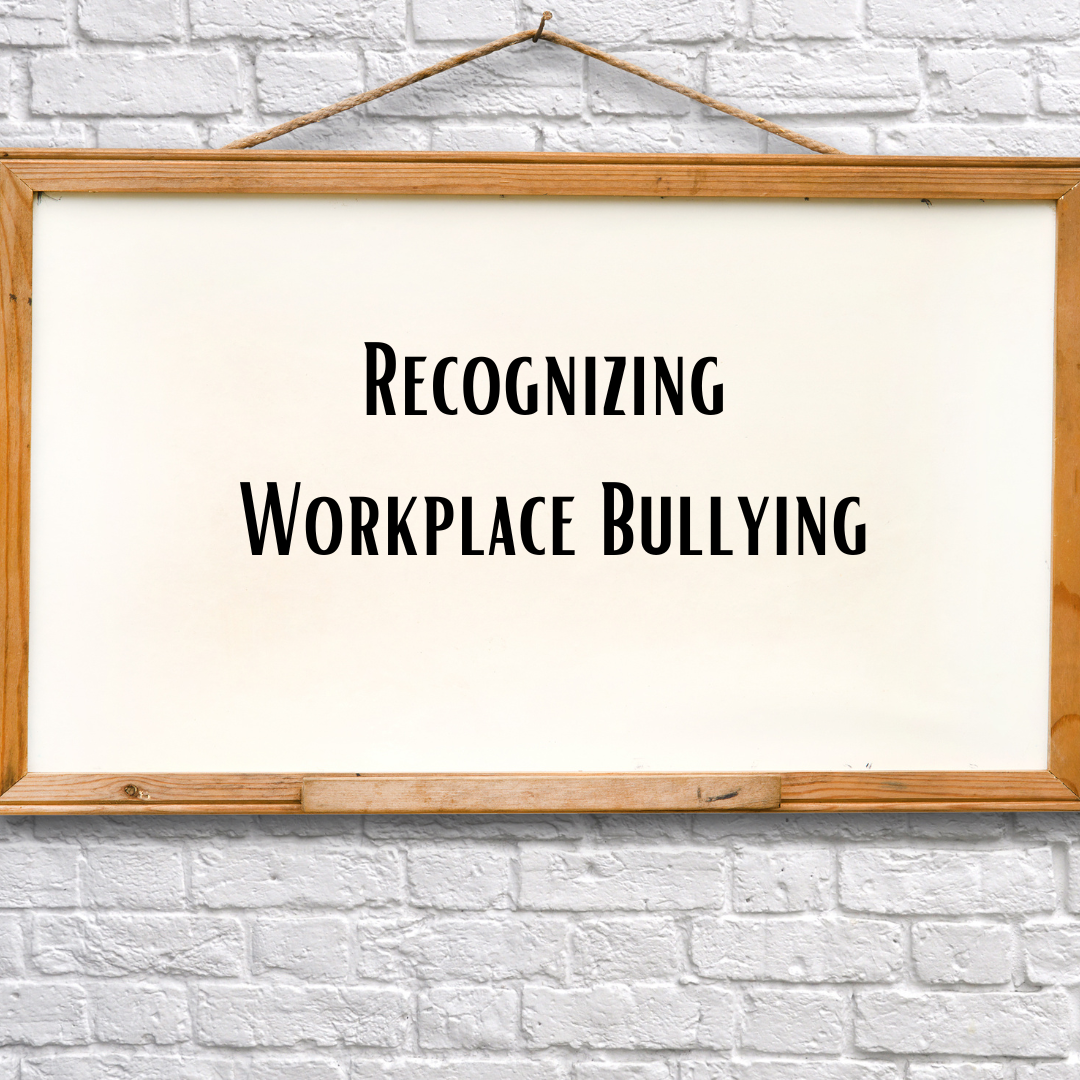 Wood signs with off white background saying in black letters recognizing workplace bullying