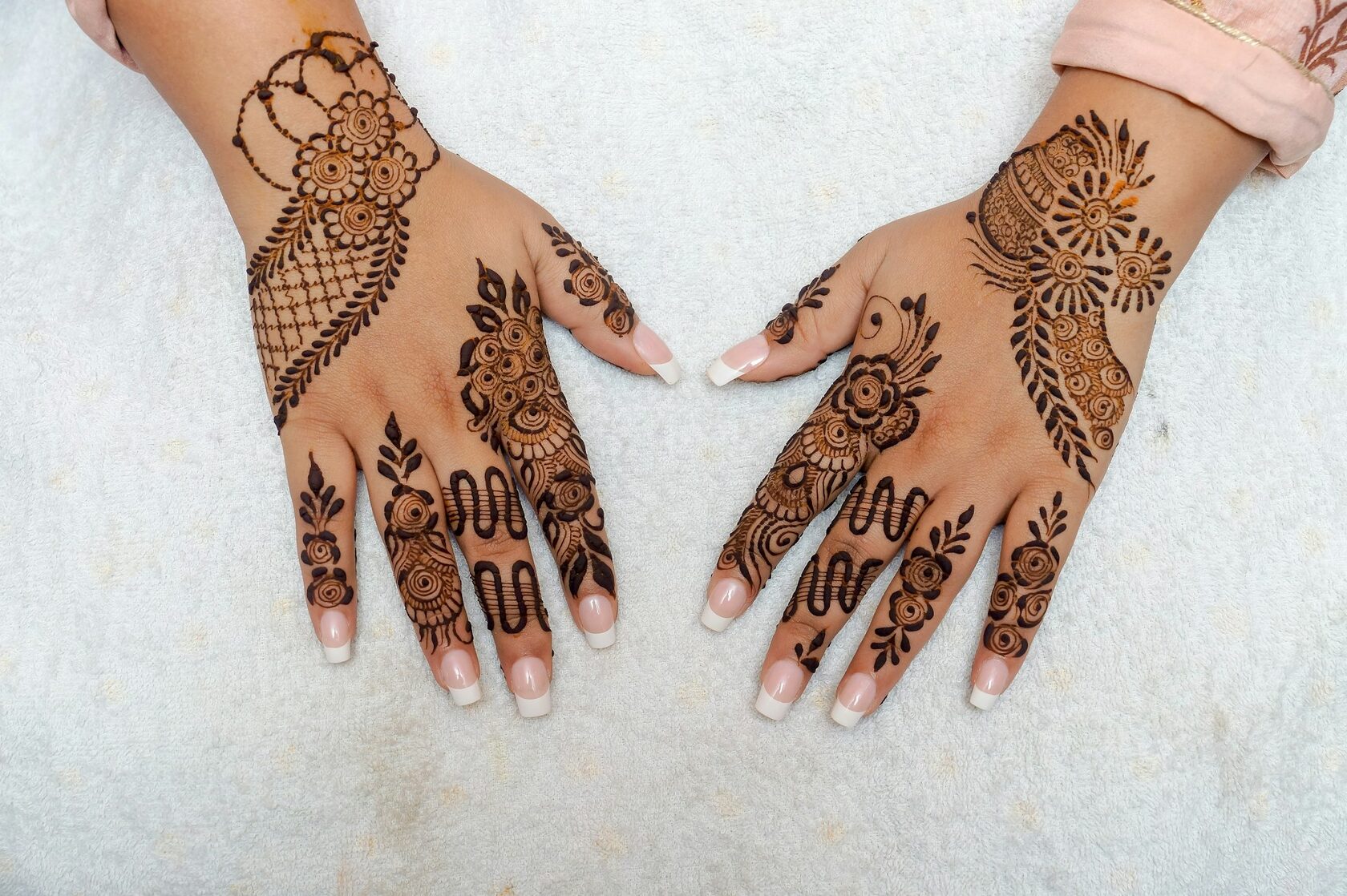 Elegant floral henna design on a hand