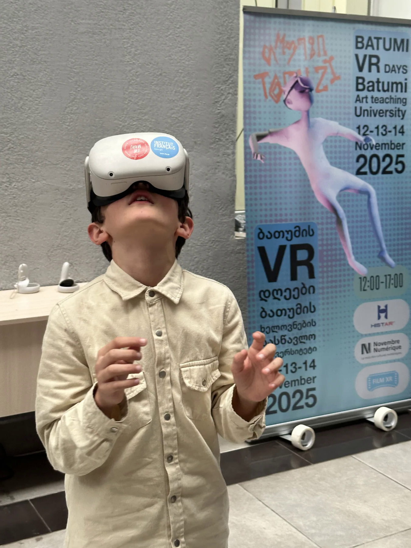 Young visitor watching an immersive film at Batumi VR Days 2025
