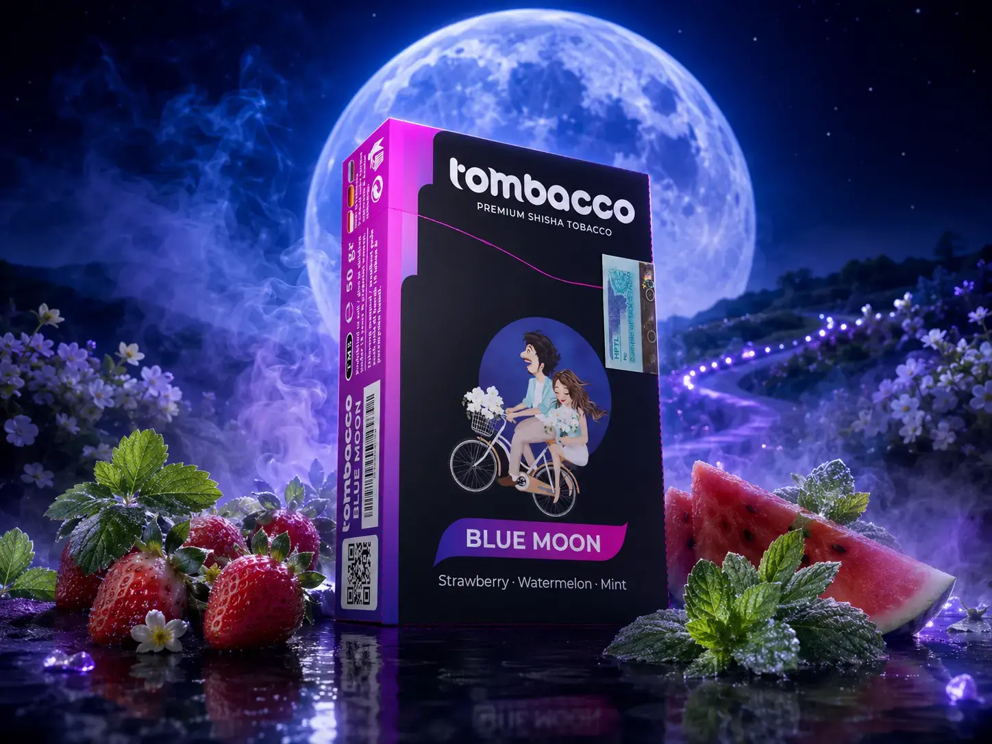 A box of Tombacco Blue Moon set against a glowing night sky, mixed with fresh strawberries, watermelon, and mint for a refreshing Adalya Alternatives Bali experience.