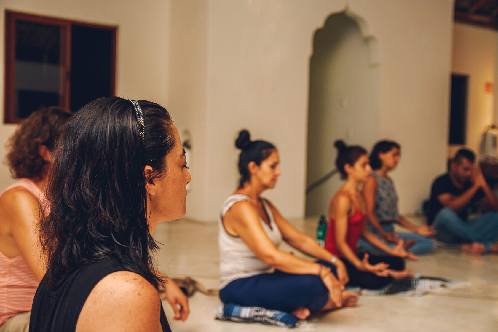 people in yoga class in seated posture