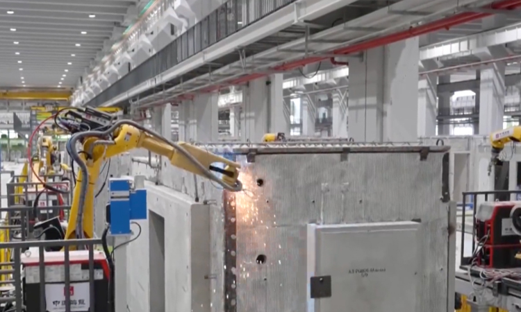 Factory-built modular housing components assembled on a production line
