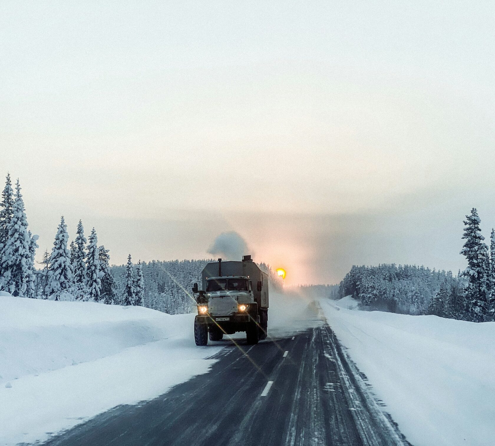 Truck driver on a winter road in Russia