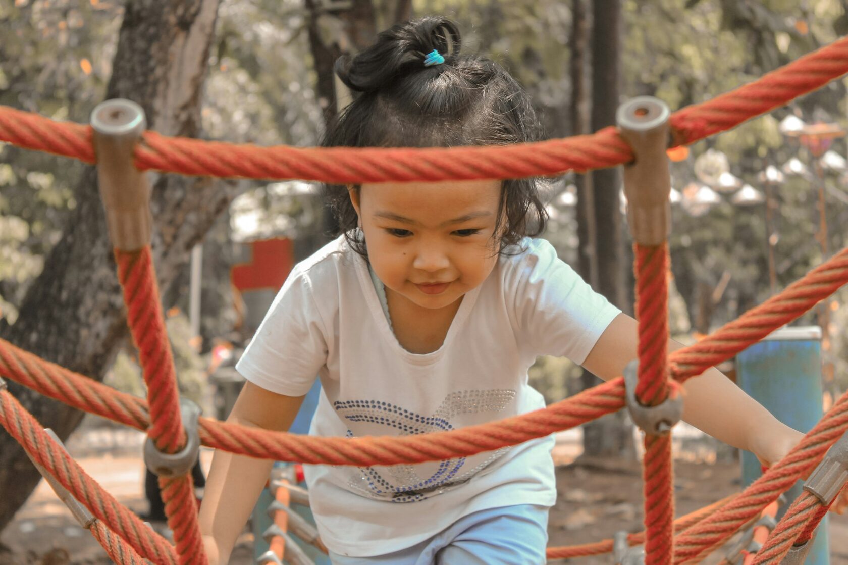 girl climbing a safety net