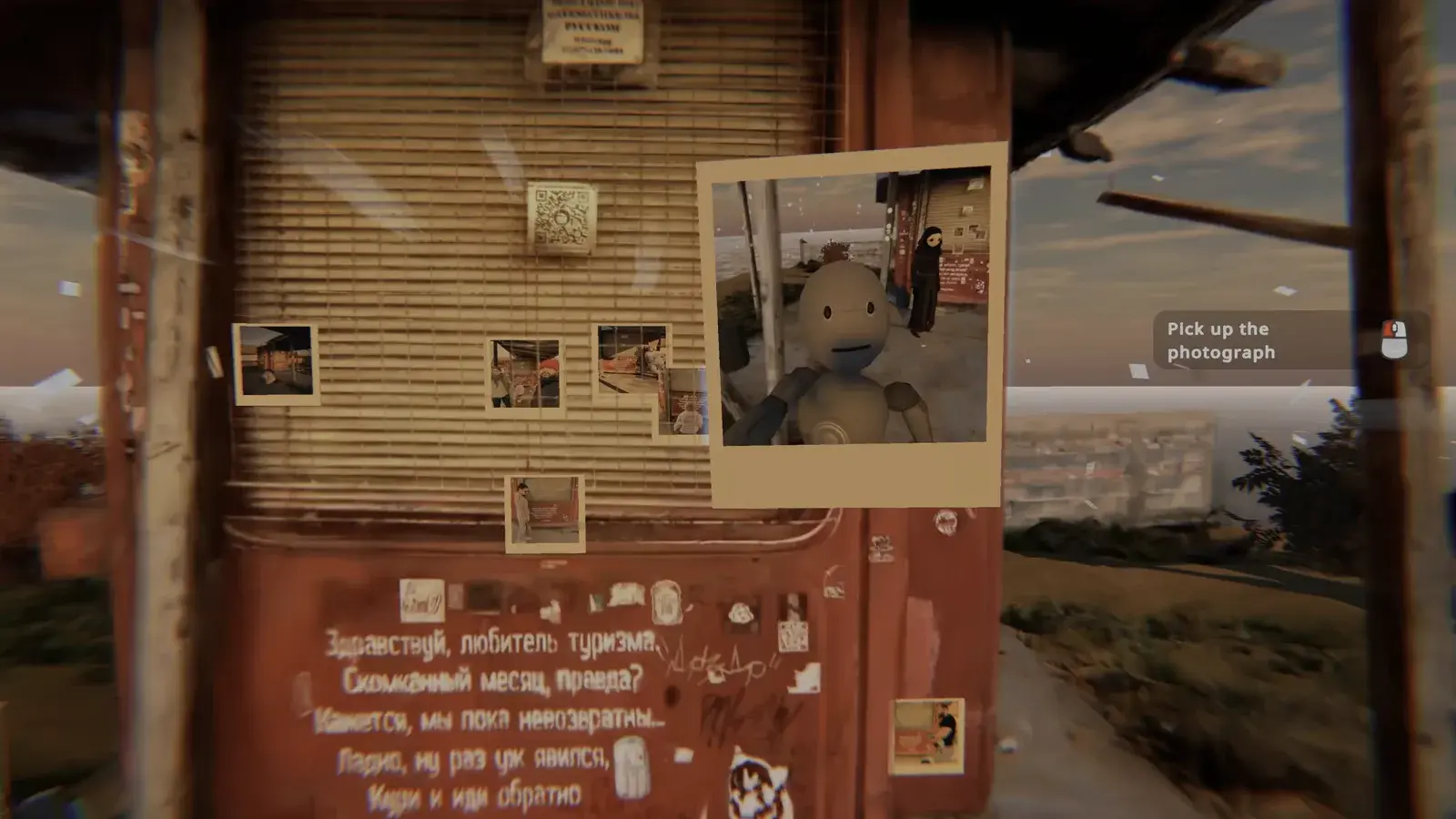 A freshly taken portrait held beside photographs on the kiosk