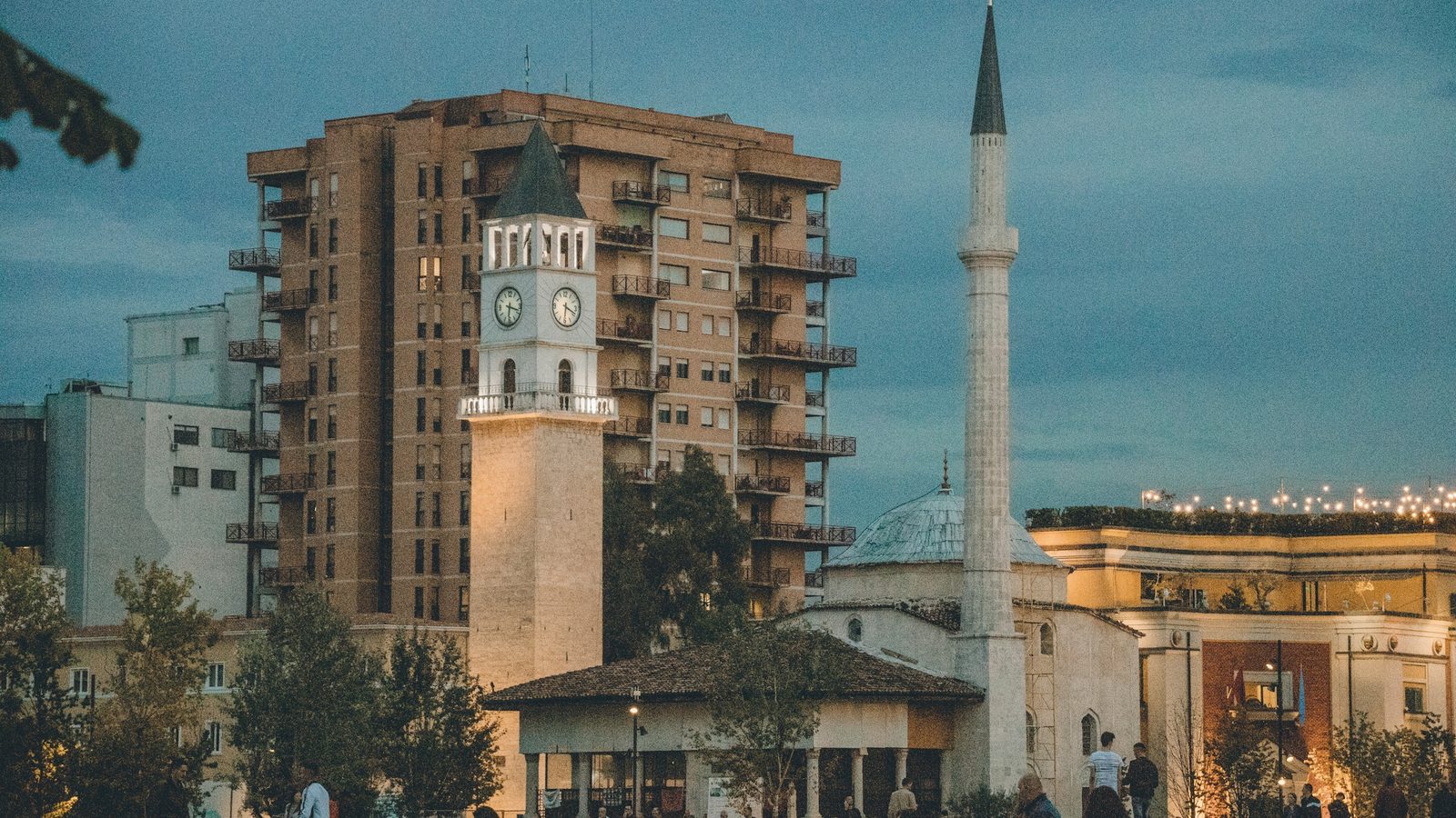 Tirana's Clock Tower and the minaret of the Et'hem Bey Mosque at dusk