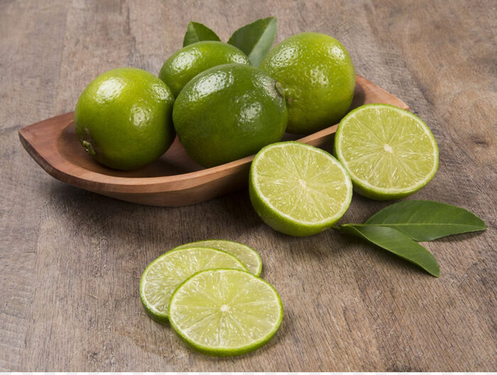 Premium Photo Fresh lime slices as a background.