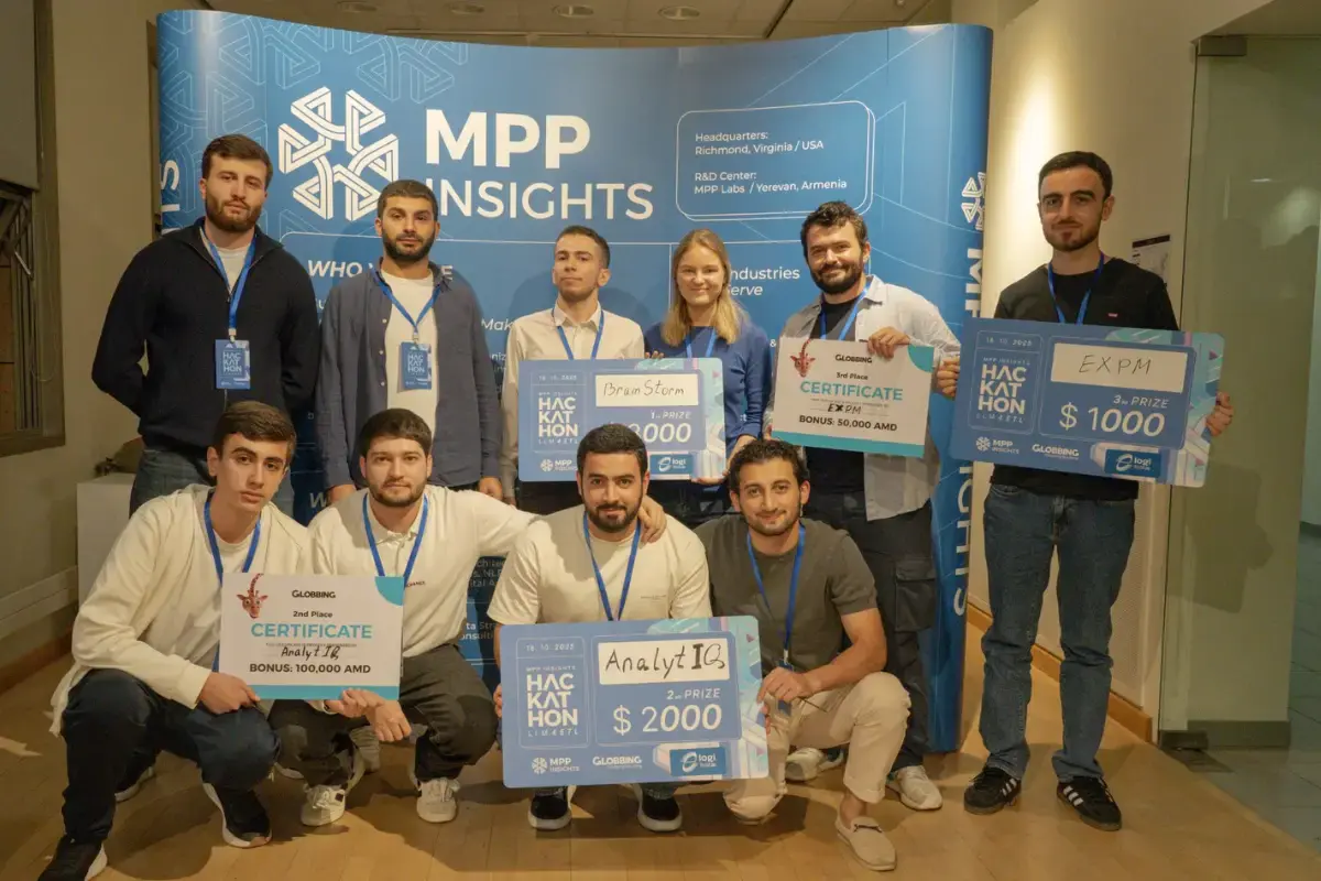 Winning team at the LLM 4 ETL Hackathon in Yerevan, Armenia holding certificates and prizes, showcasing AI and LLM projects