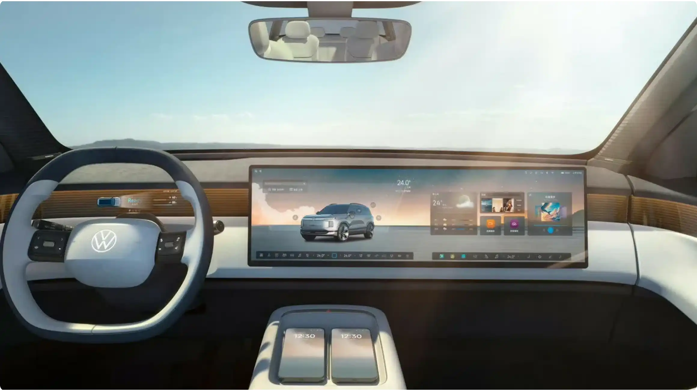 Интерьер Volkswagen ID. Era 8X: двухспицевый руль, мультимедийный комплекс из двух 15,6-дюймовых экранов, беспроводная зарядка на центральном тоннеле.