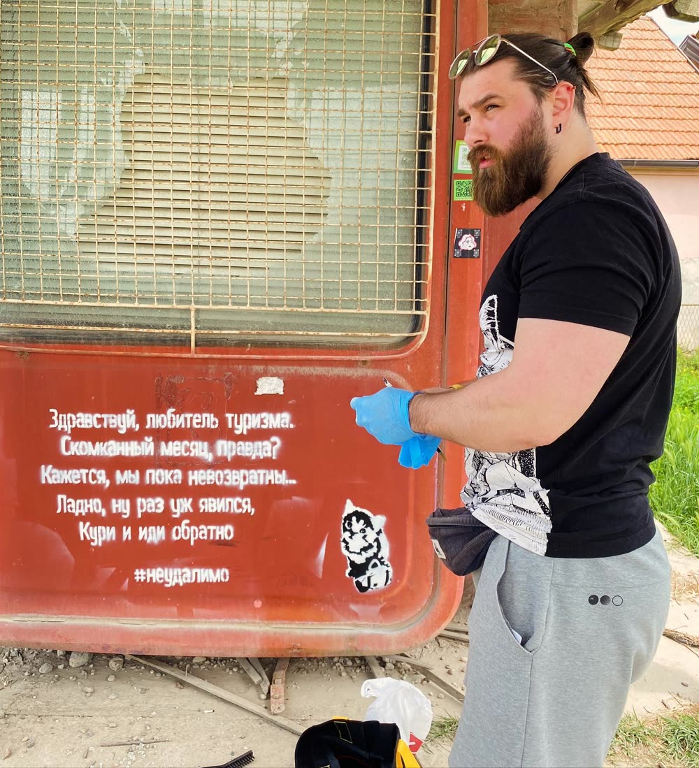 Ivan Neudalimo working on the K67 kiosk wall