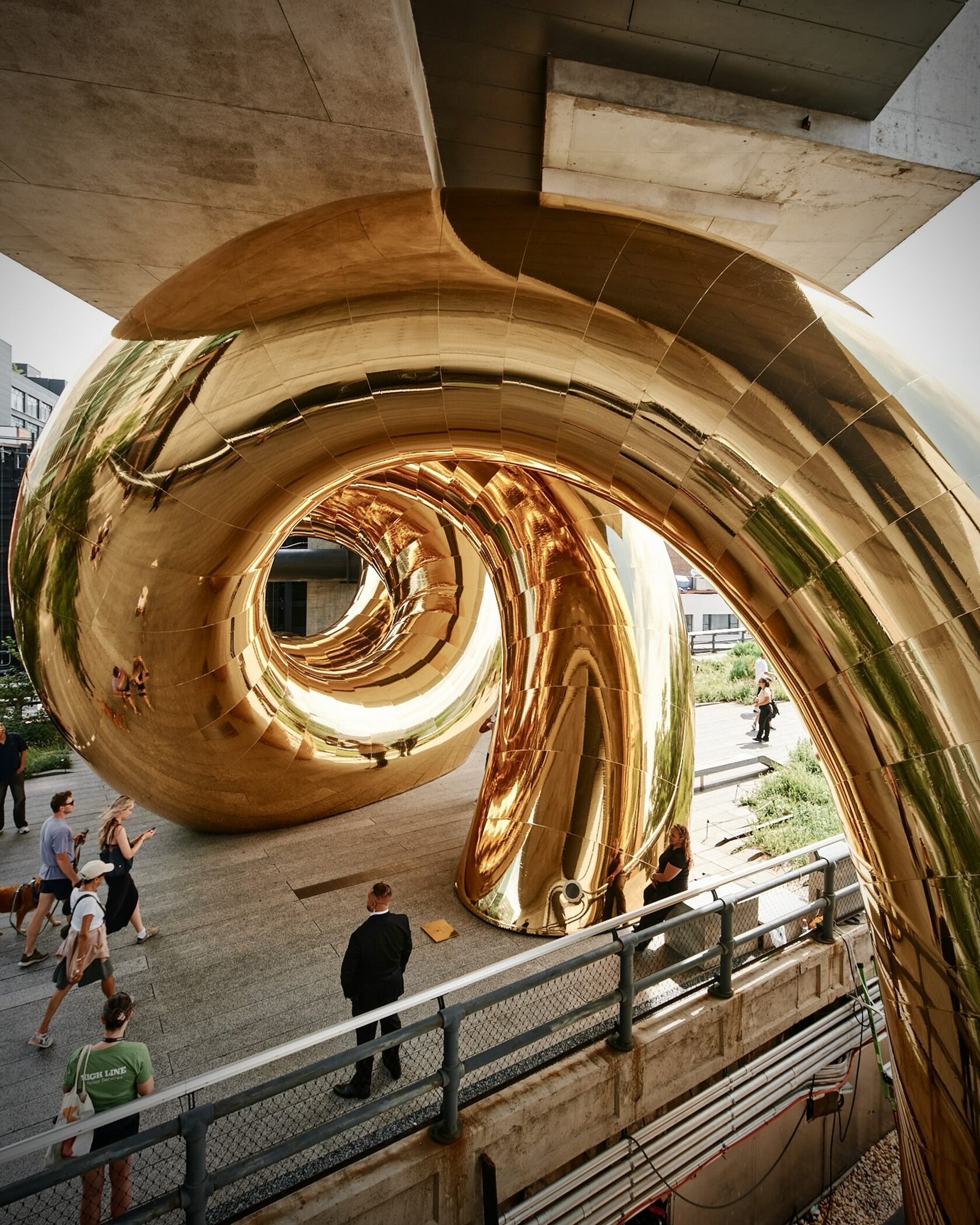 GORK Mirrored loops of the inflatable auruBOROS installation above a High Line walkway beneath The Standard Hotel’s concrete structure