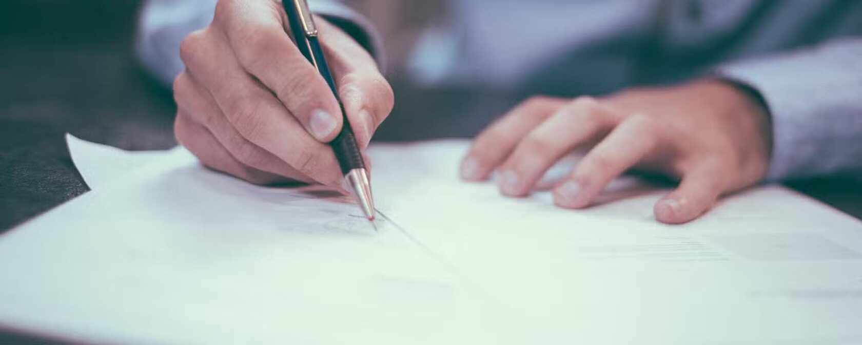 Man signing a contract