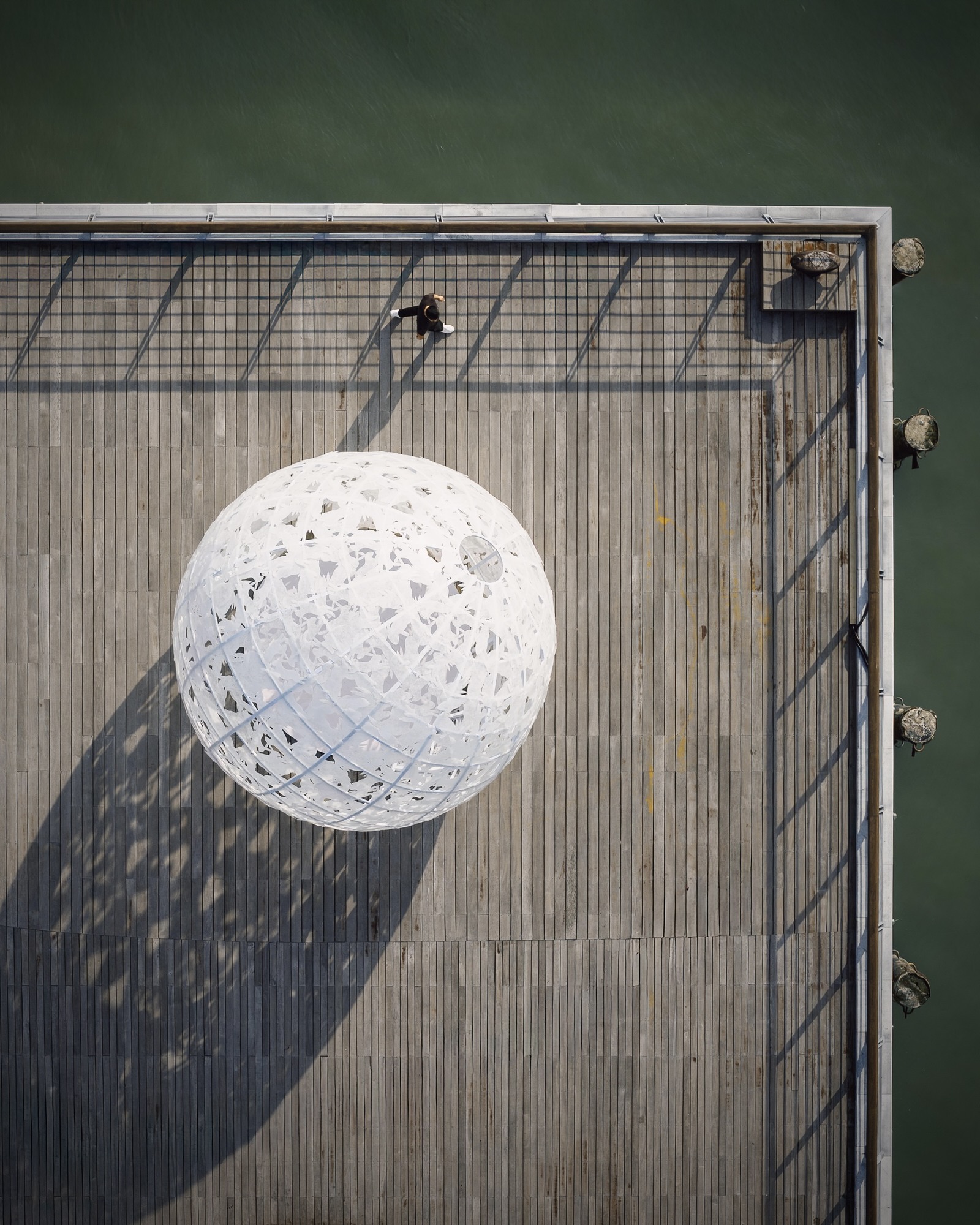 GORK The Full Moon: overhead view of the openwork sphere and timber pier