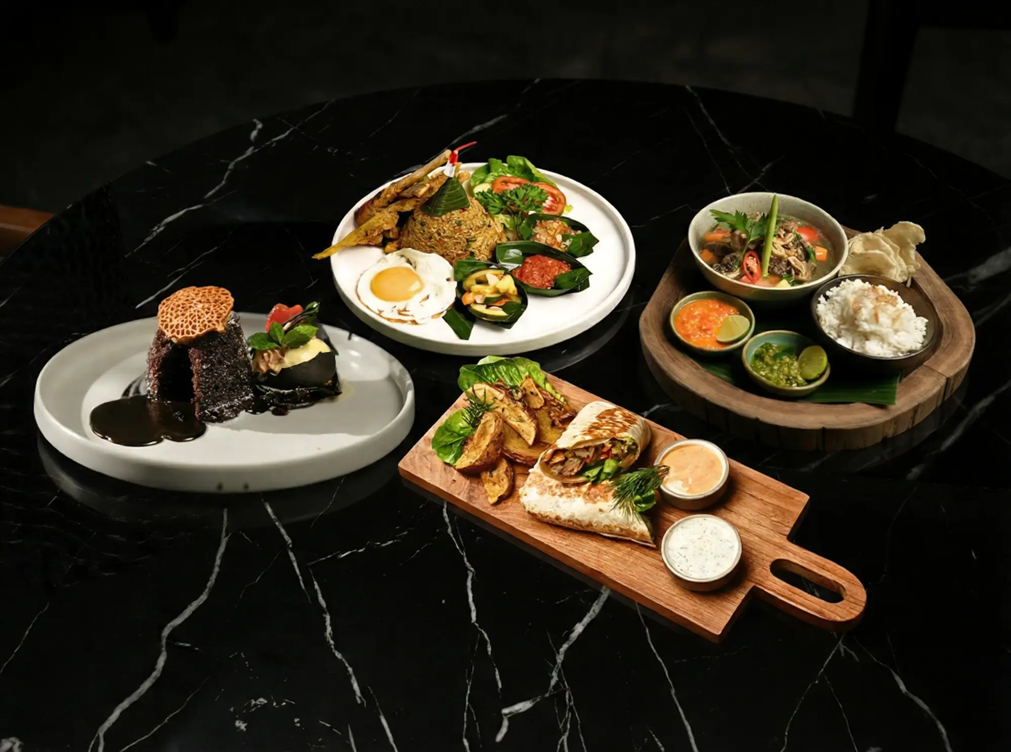 A hearty meal option for a halal iftar in Bali, featuring the 'I'm Starving' combo at Eden Lounge with Sop Buntut, Nasi Goreng, a chicken shawarma, and a molten chocolate brownie melt.