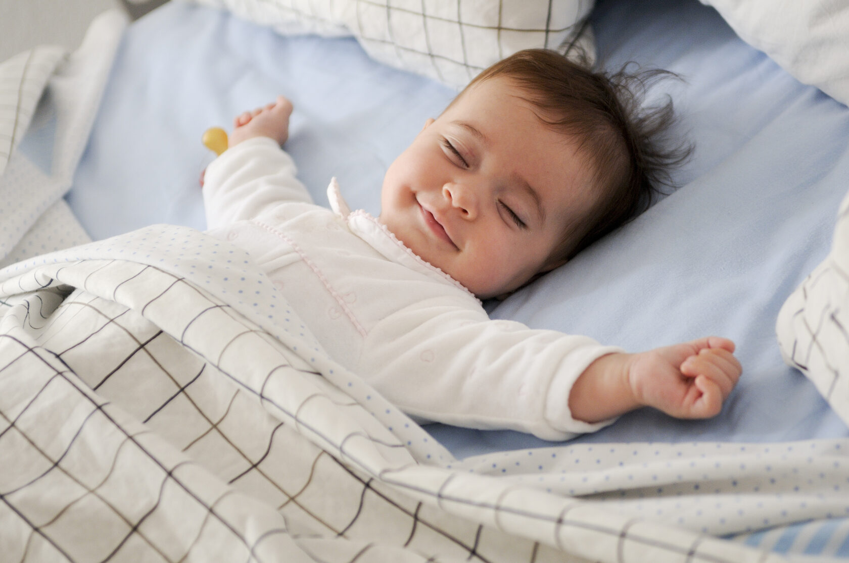 Sleeping newborn peacefully resting with calming white noise and gentle lullabies in the background