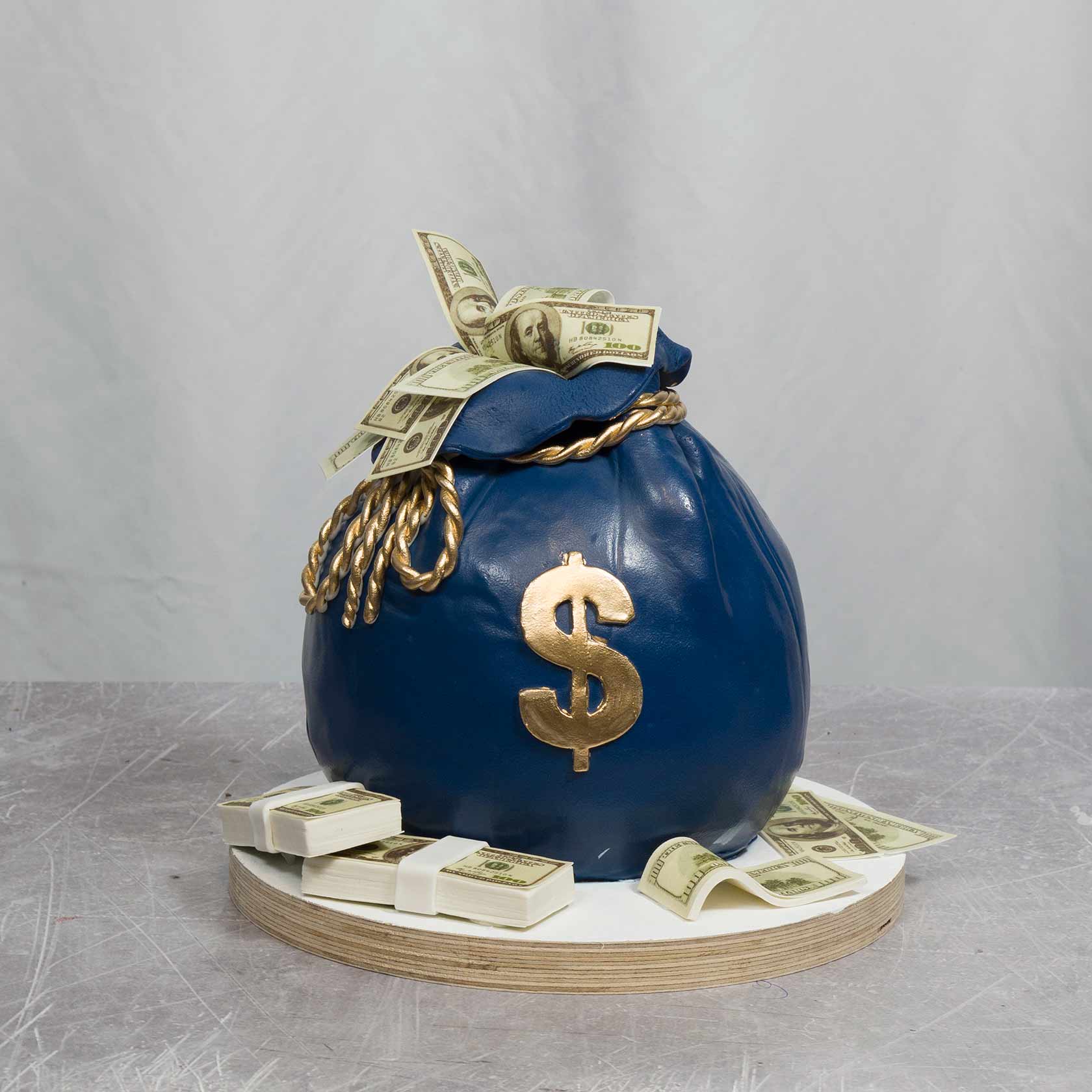 Royal blue money bag cake in fondant. by @multicolorevents Tel 786