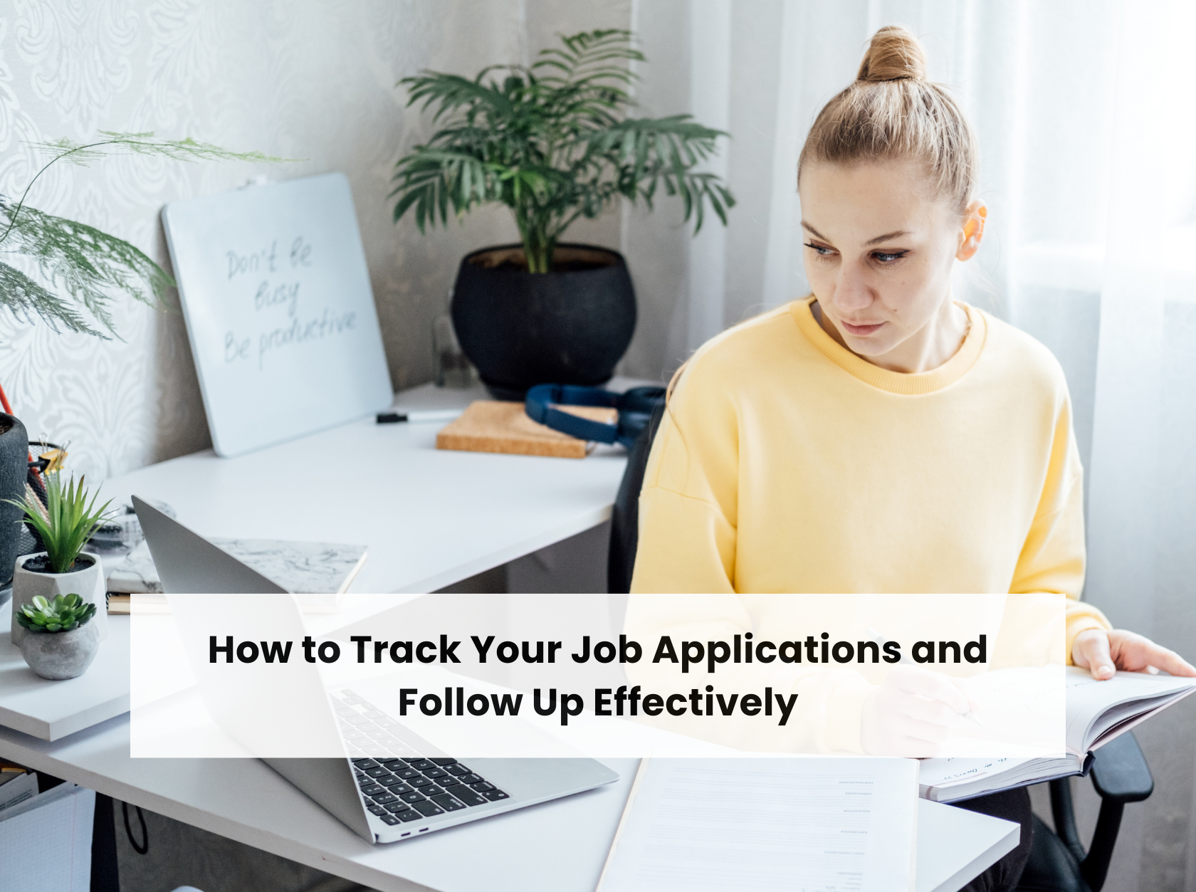 Job seeker using laptop and taking notes during job application process