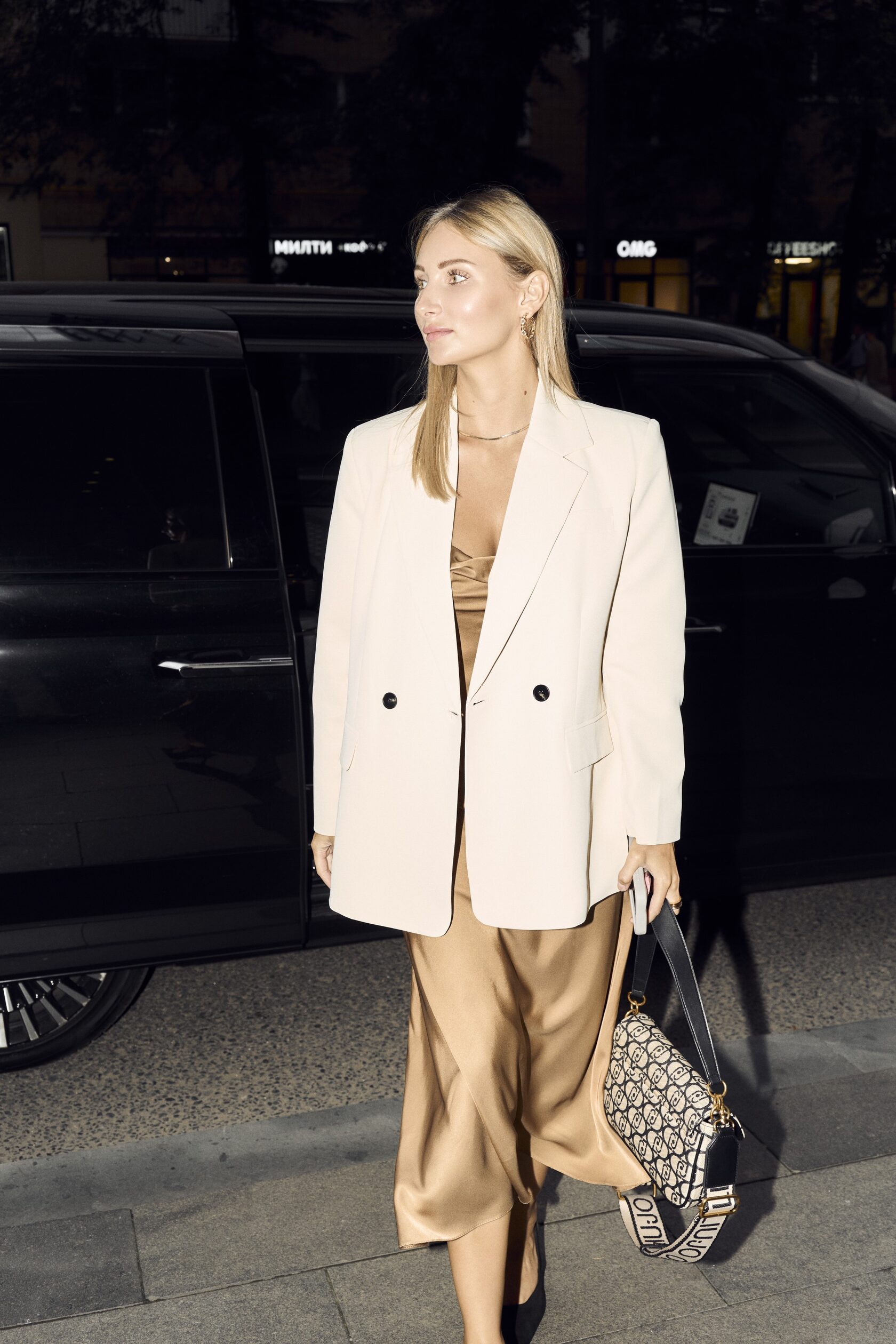 Couple at airport woman wearing oversized jacket romantic travel