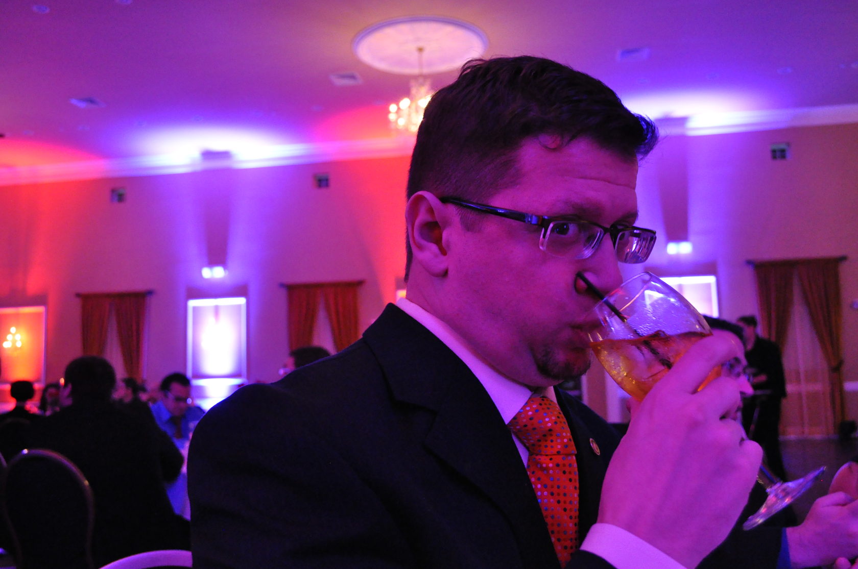 Tony drinking cocktail at SigEp Charter Anniversary Banquet