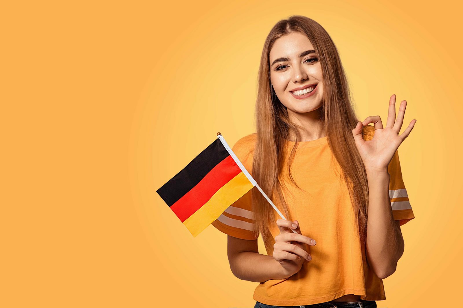 Языке post. Девушка с немецким флагом. Изучение немецкого языка. Люди с флагом Германии. Студенты с флагами.