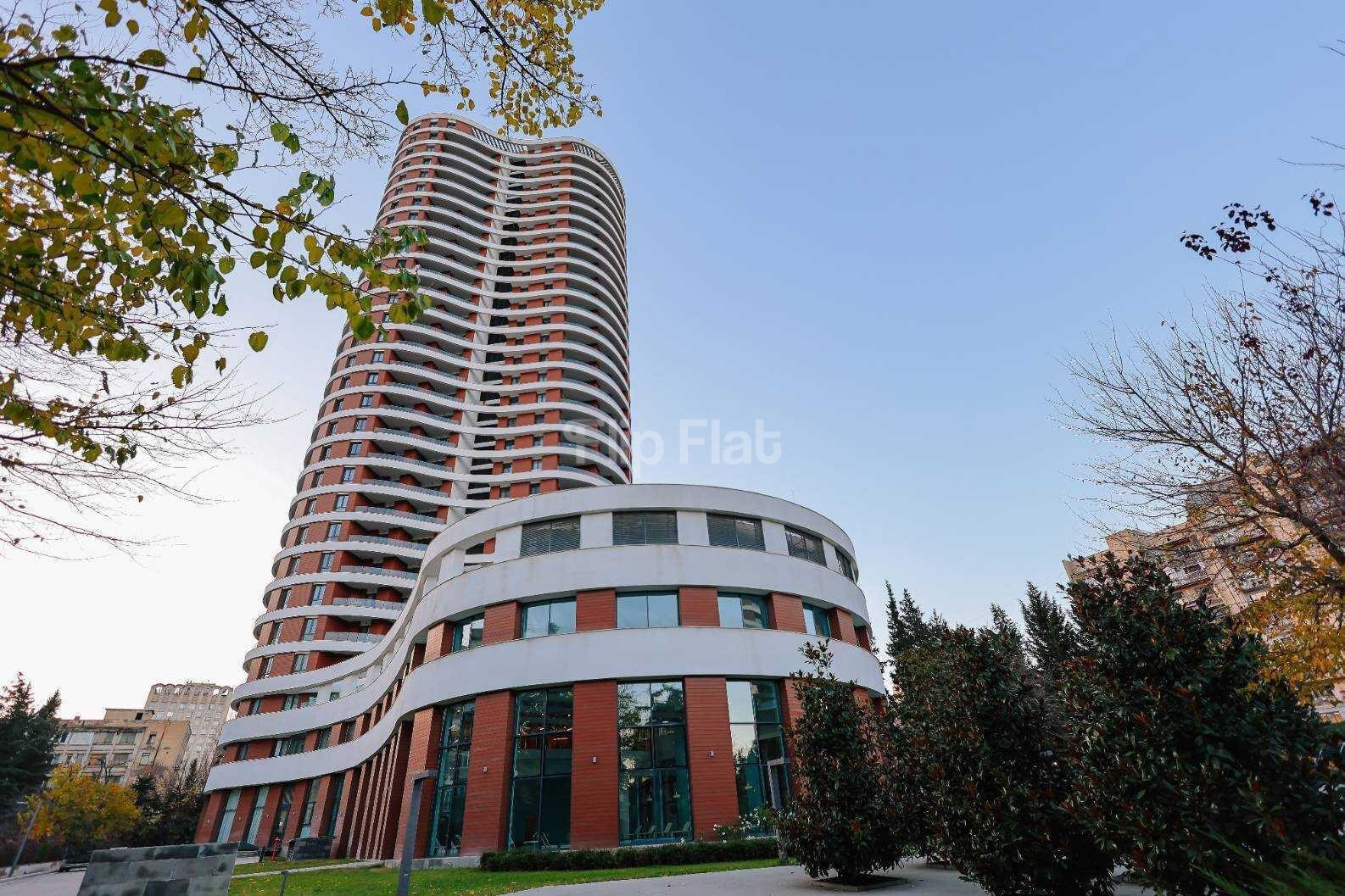 Modern high-rise residential building in Tbilisi, a verified property from the Flip Flat agency database.
