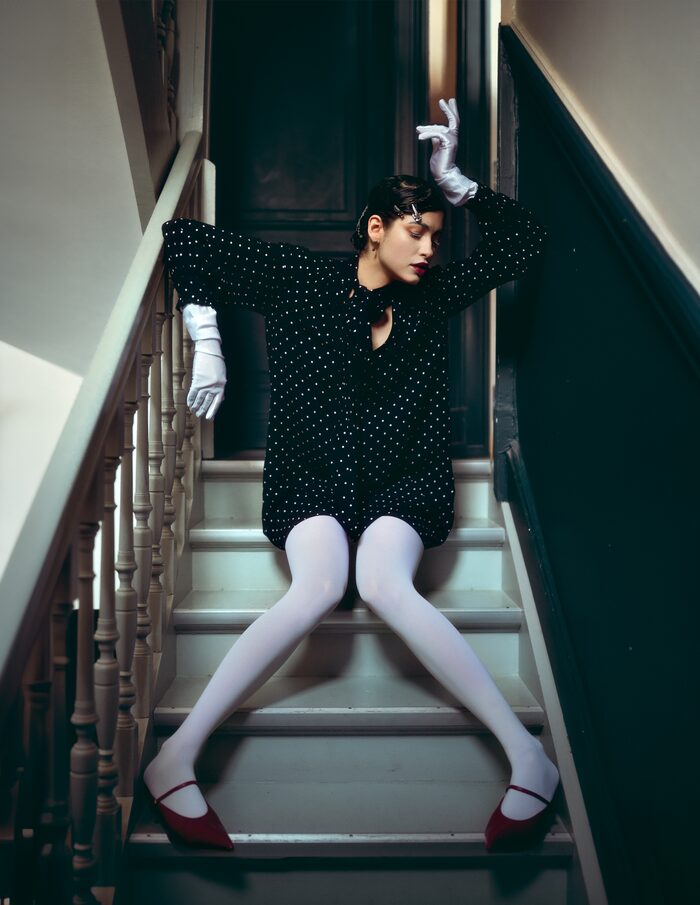 Artells Magazine fashion editorial photographed on a staircase