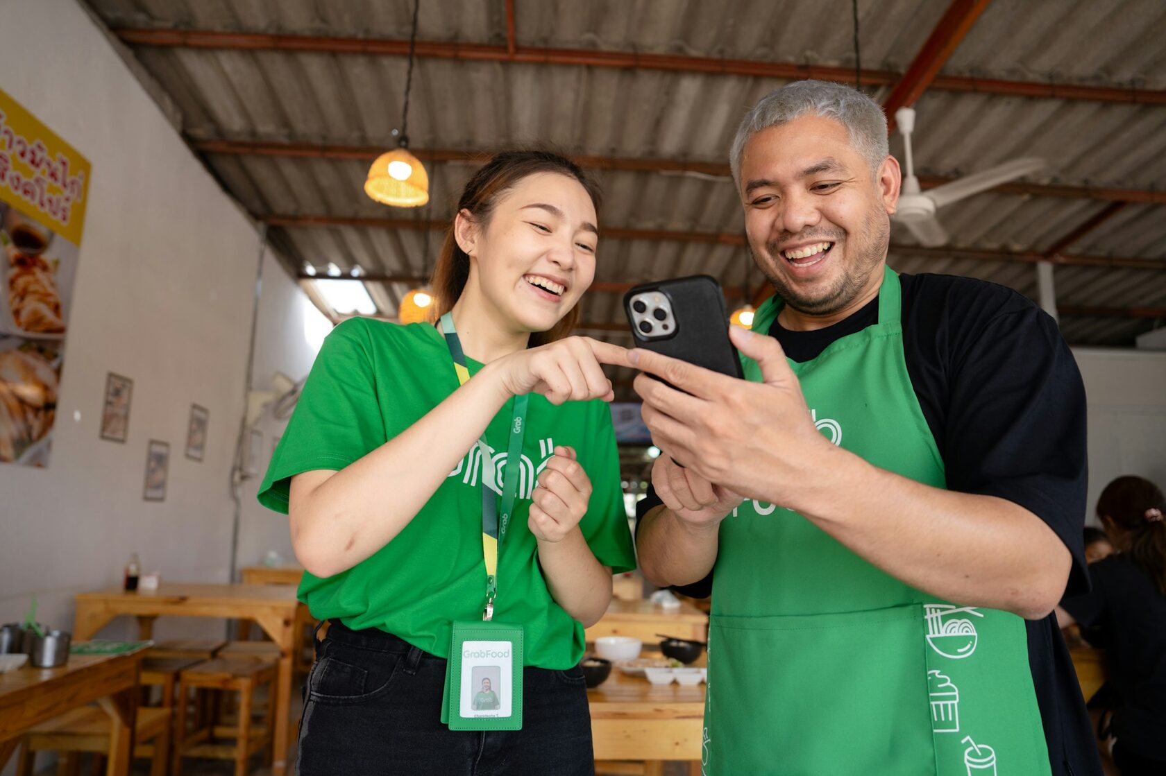 Volunteers and elderly people smiling together
