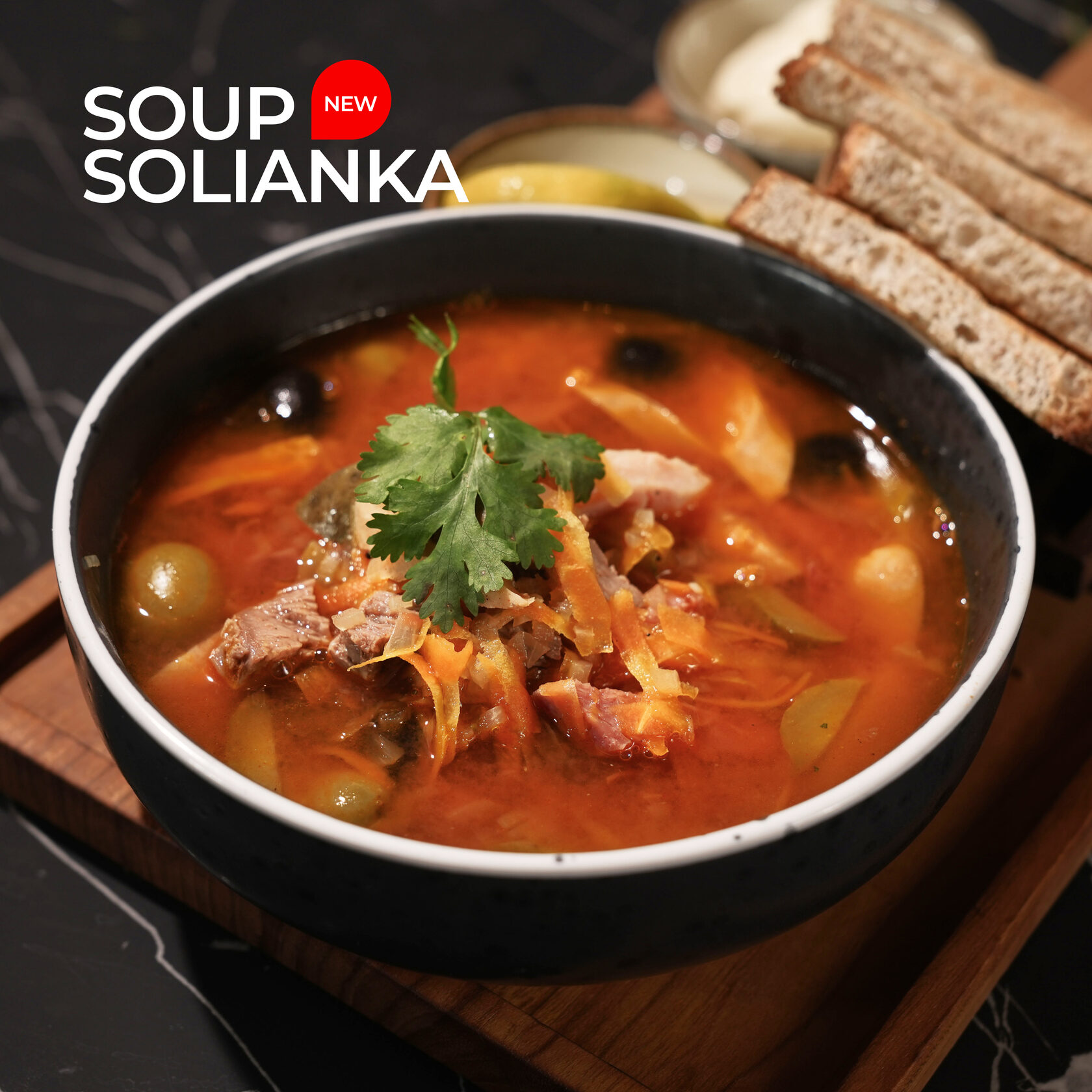 Solyanka soup. Bread, garlic and rich soup.