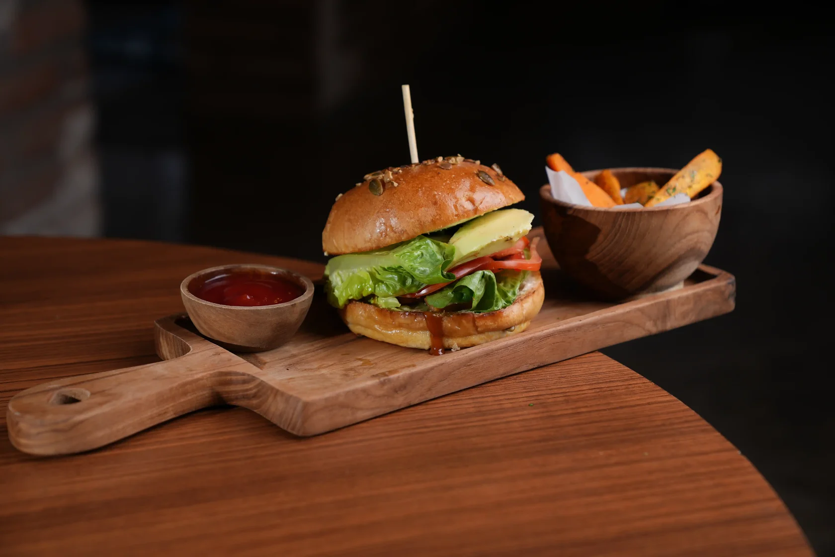 Eden Signature Beef Burger served with fresh vegetables and sweet potato fries