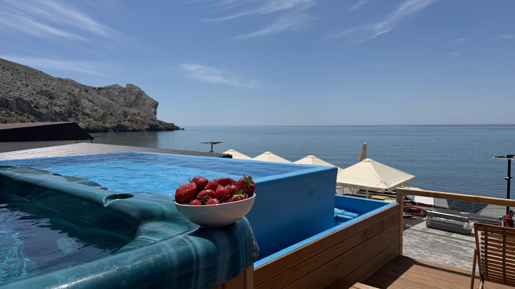 Poolside sun terrace overlooking the bay