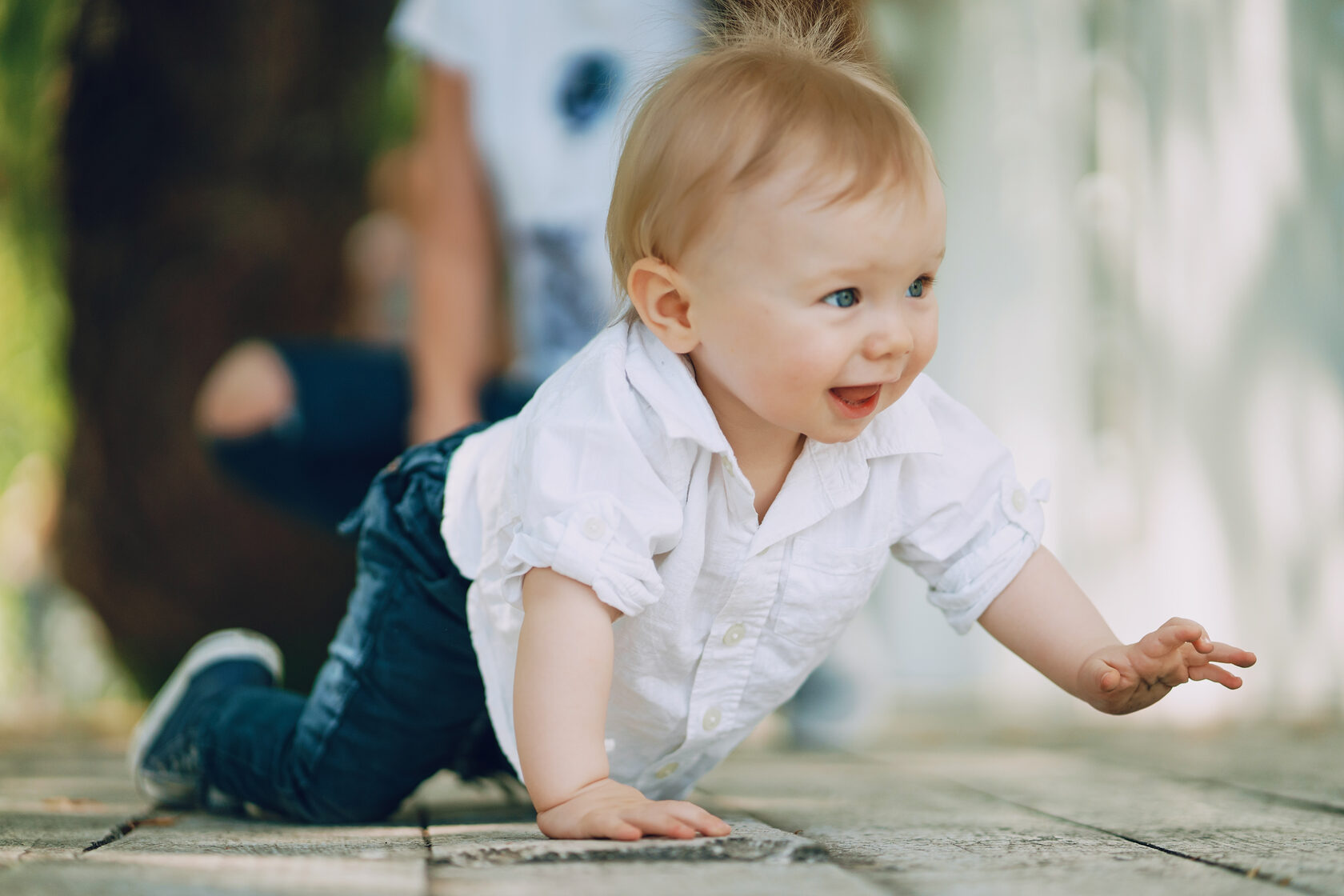 Two year old milestone — toddler learning balance and coordination while crawling