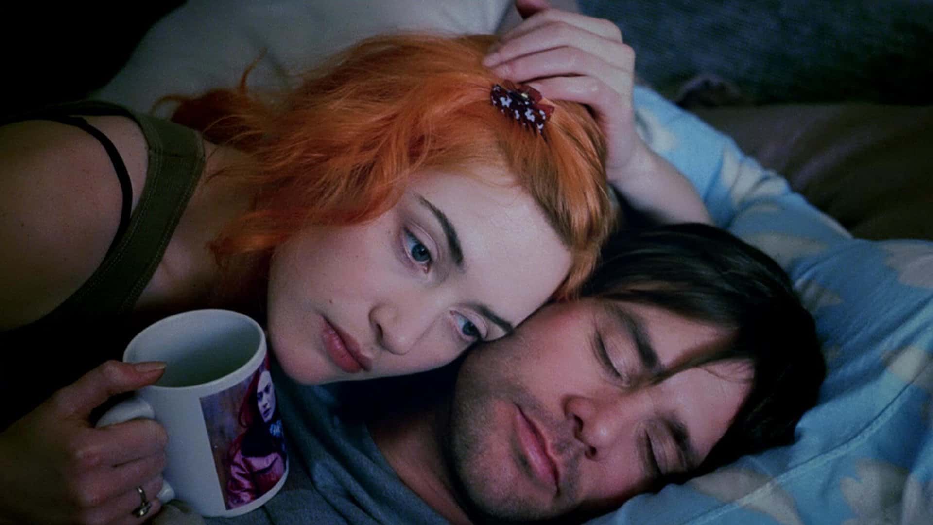 Eternal Sunshine of the Spotless Mind: Joel sleeps while Clementine lays awake next to/on him holding a coffee mug.