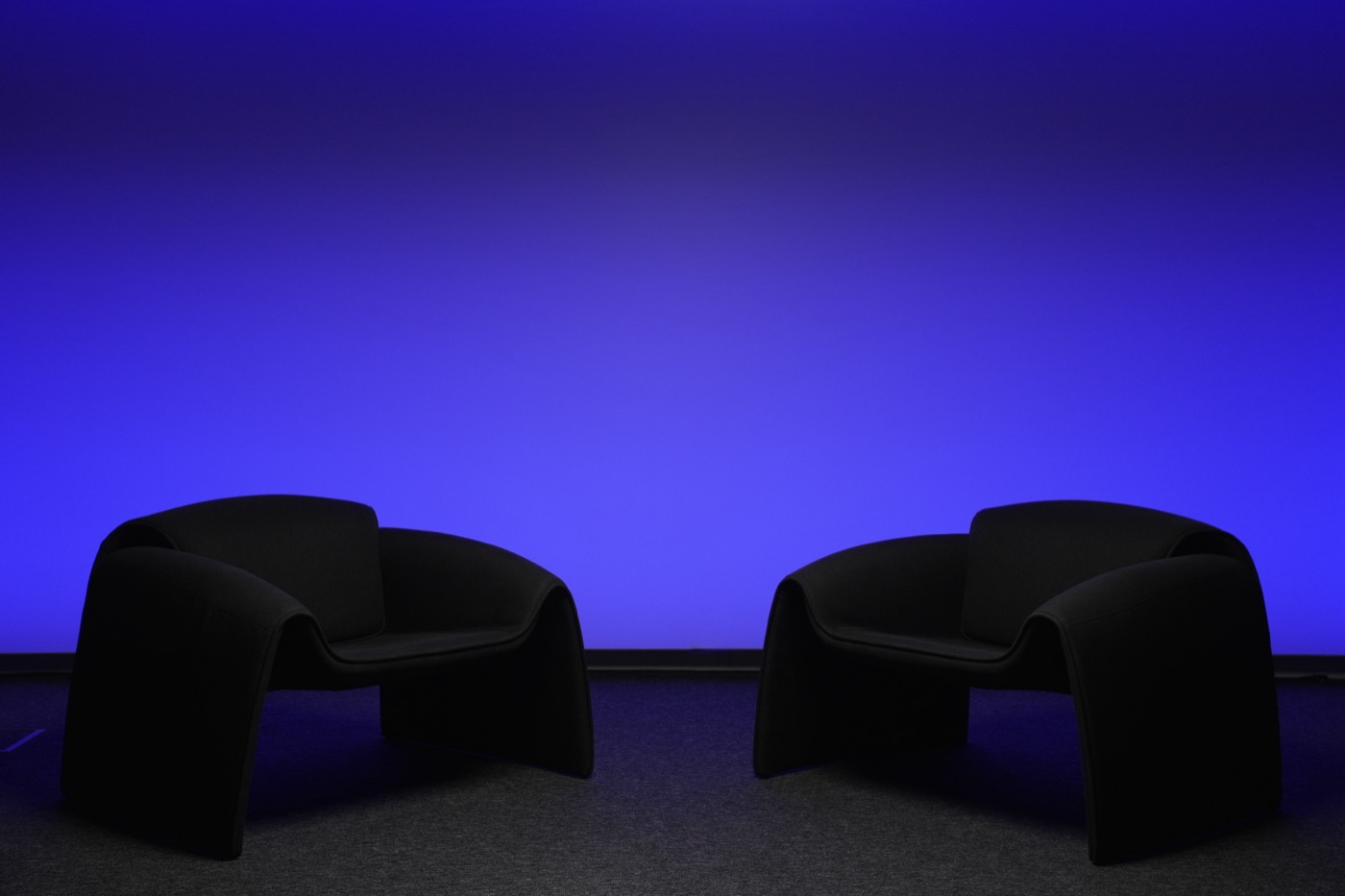 Studio wall lit in a deep blue