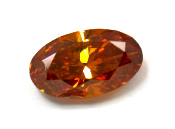 Овальный бриллиант 1,02 карата глубокого фантазийного оранжевого цвета с коричневато-желтым нацветом.